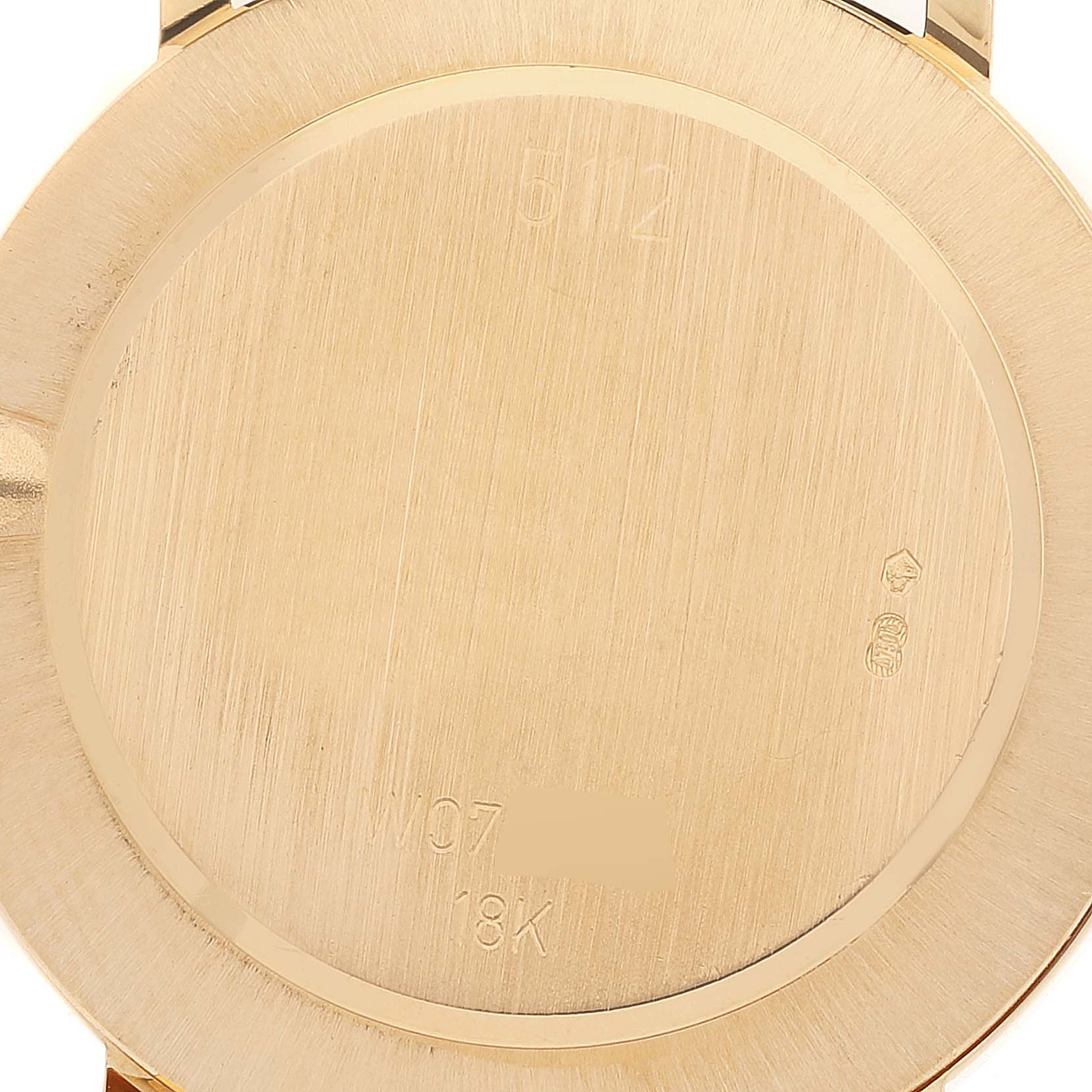 This image shows the back of a Rolex Cellini 5112 Men's Yellow Gold Beige Dial 5112 Men's Yellow Gold Beige Dial watch, highlighting the brushed gold case with engravings.