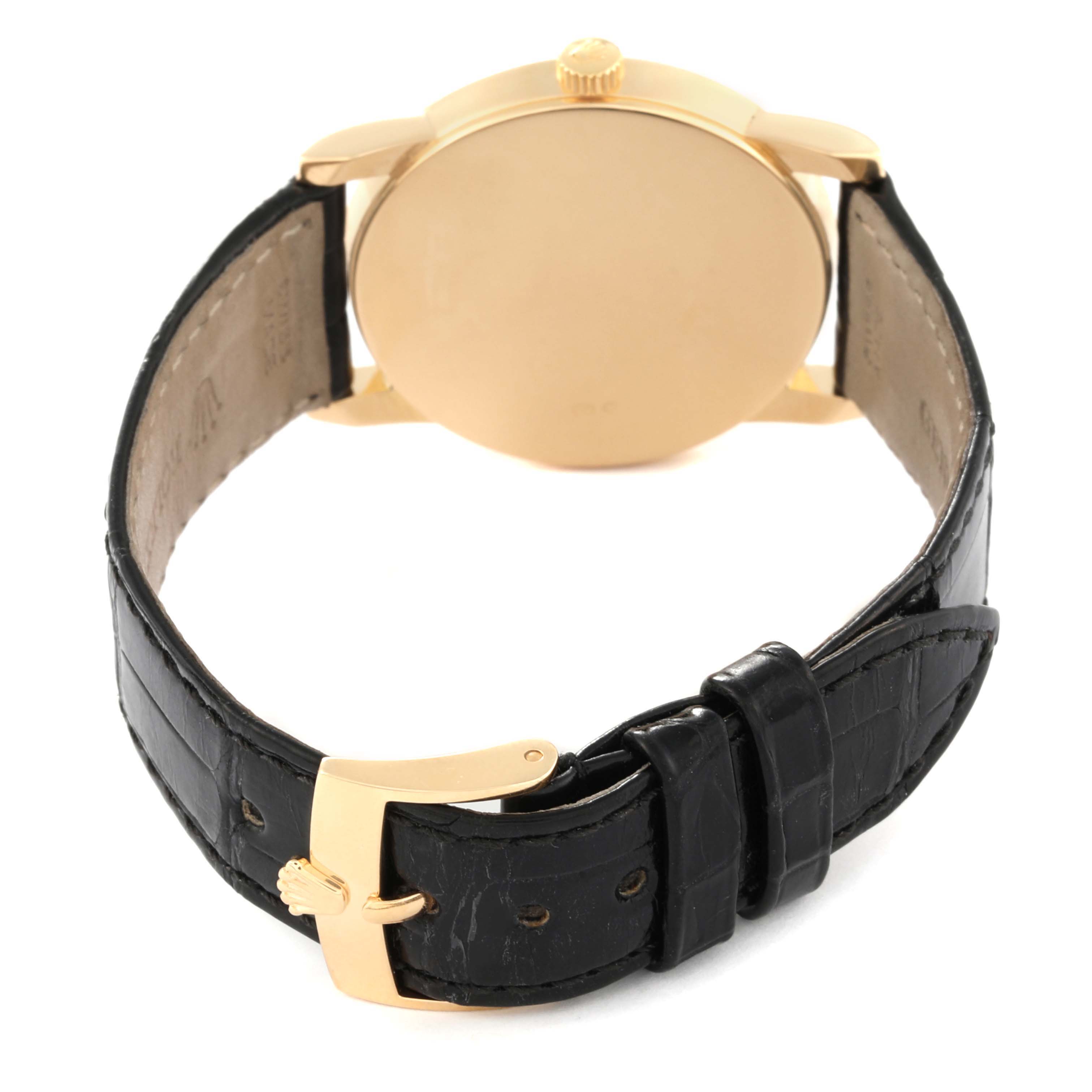 The image shows the back of the Rolex Cellini 5116 Men's Yellow Gold White Dial 5116 Men's Yellow Gold White Dial watch, highlighting the gold case and black leather strap with a gold buckle.