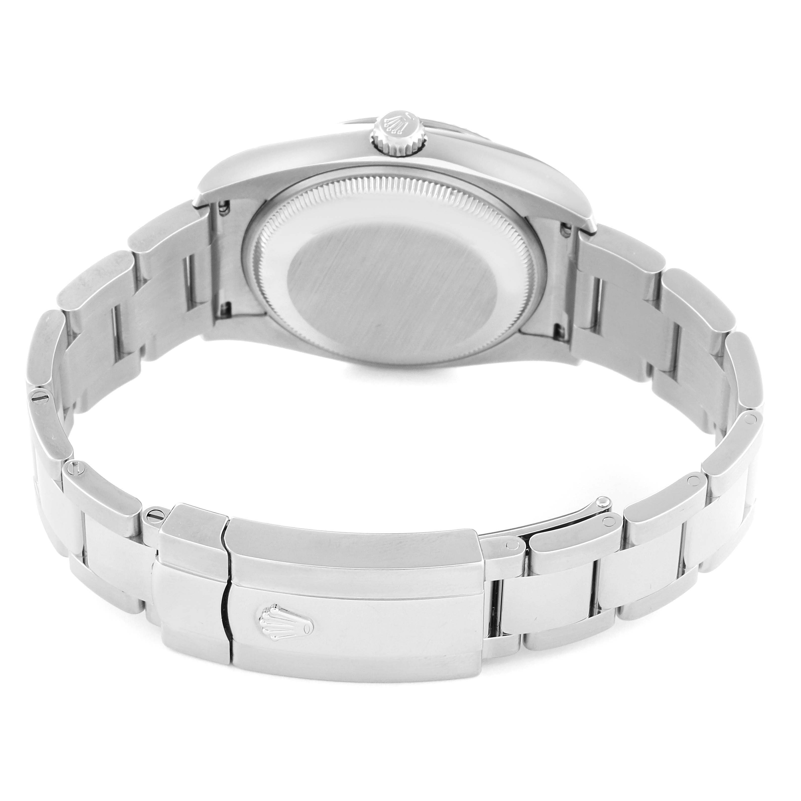 This image shows the back view of the Rolex Date 115234 Men's Stainless Steel Black Dial 115234 Men's Stainless Steel Black Dial model, highlighting the case back, bracelet, and clasp.