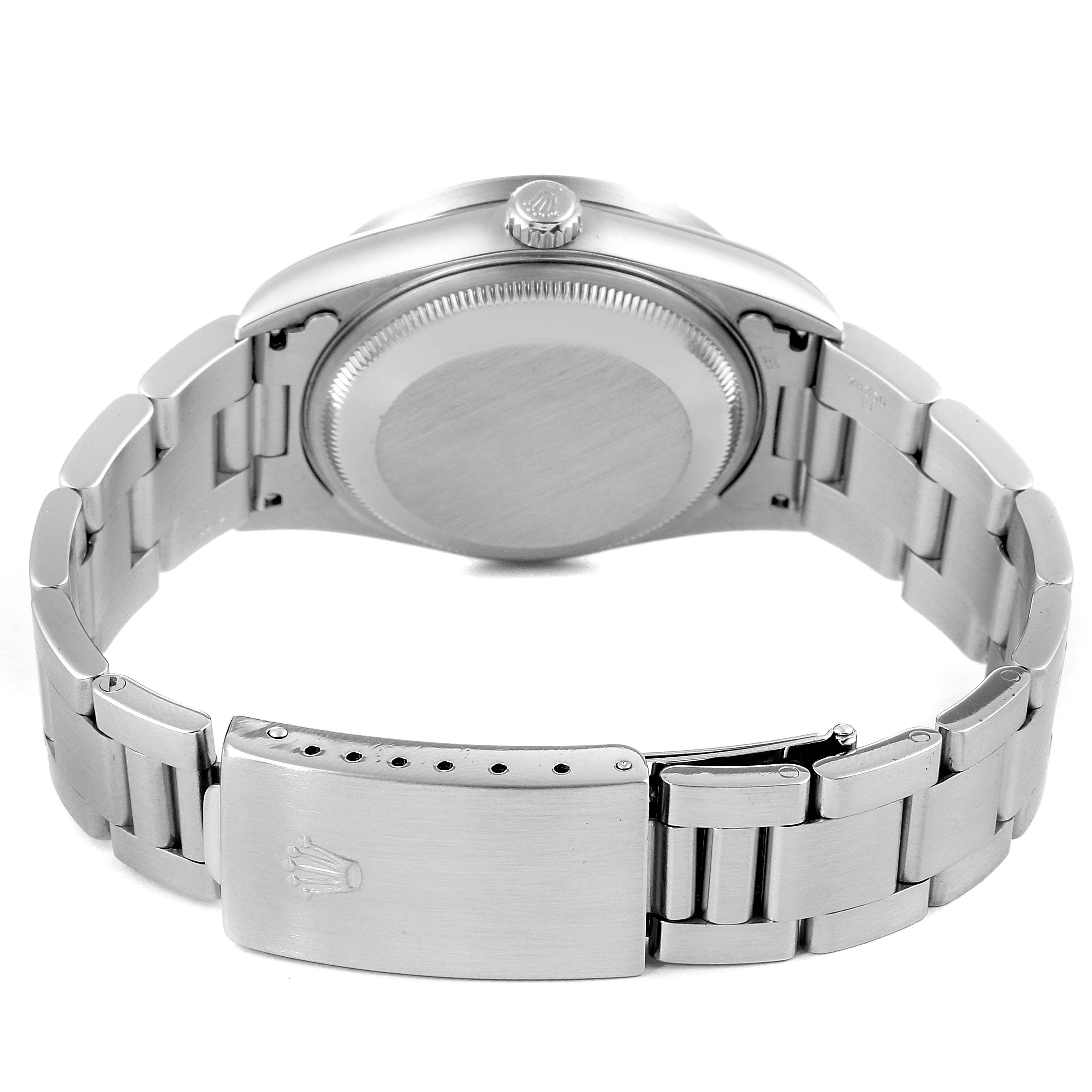 The image shows the back view of a Rolex Date 15210 Men's Stainless Steel Blue Dial 15210 Men's Stainless Steel Blue Dial model watch, highlighting the case back, clasp, and bracelet links.