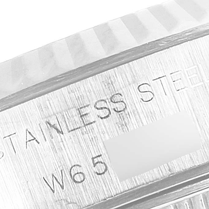 The image shows a close-up angle of the case back edge of the Rolex Datejust 69174 Women
s Stainless Steel White Dial 69174 Women
s Stainless Steel White Dial watch, highlighting stainless steel engraving.