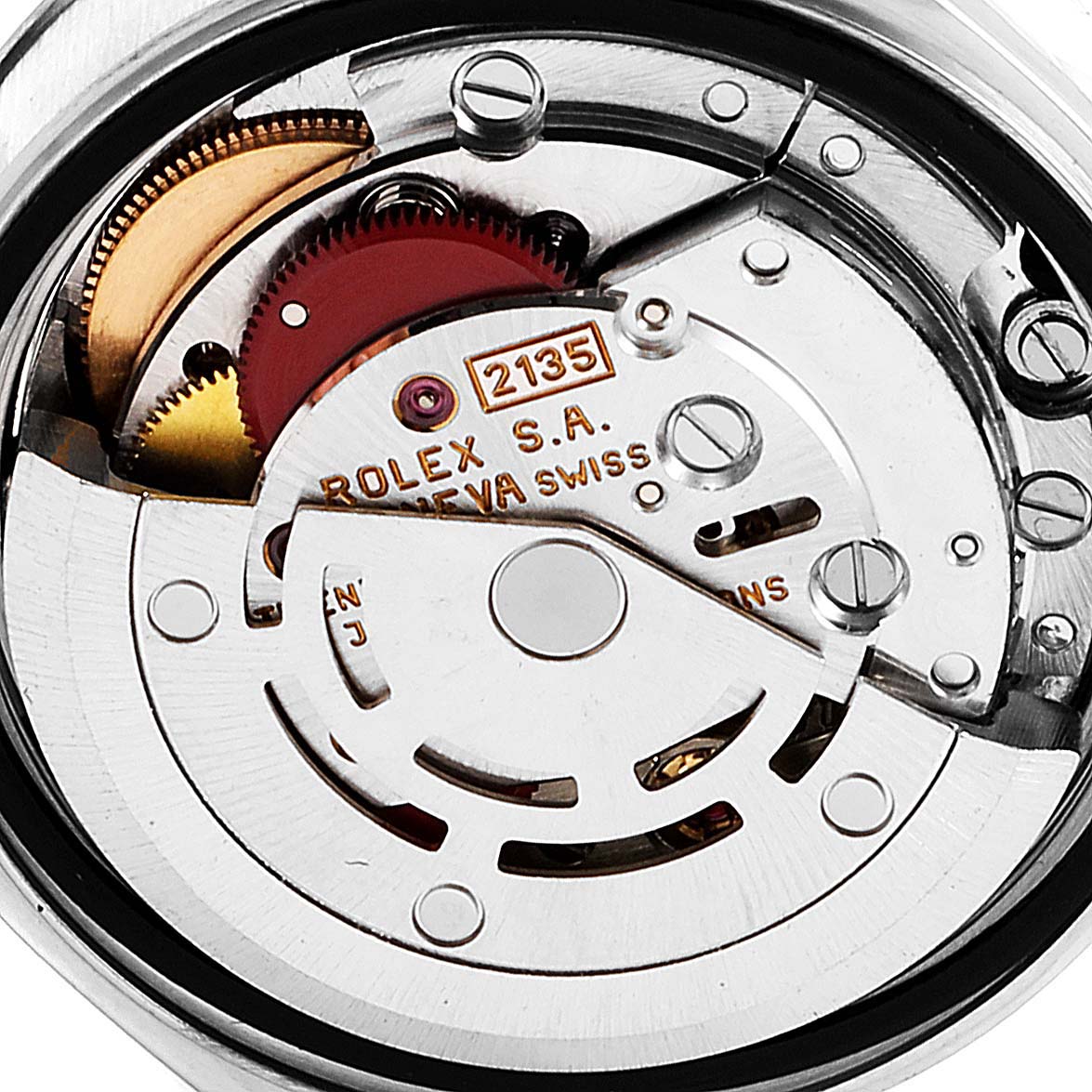 The image shows the movement mechanism and internal parts of the Rolex Datejust 69174 Women
s Stainless Steel White Dial 69174 Women
s Stainless Steel White Dial watch from a close-up angle.