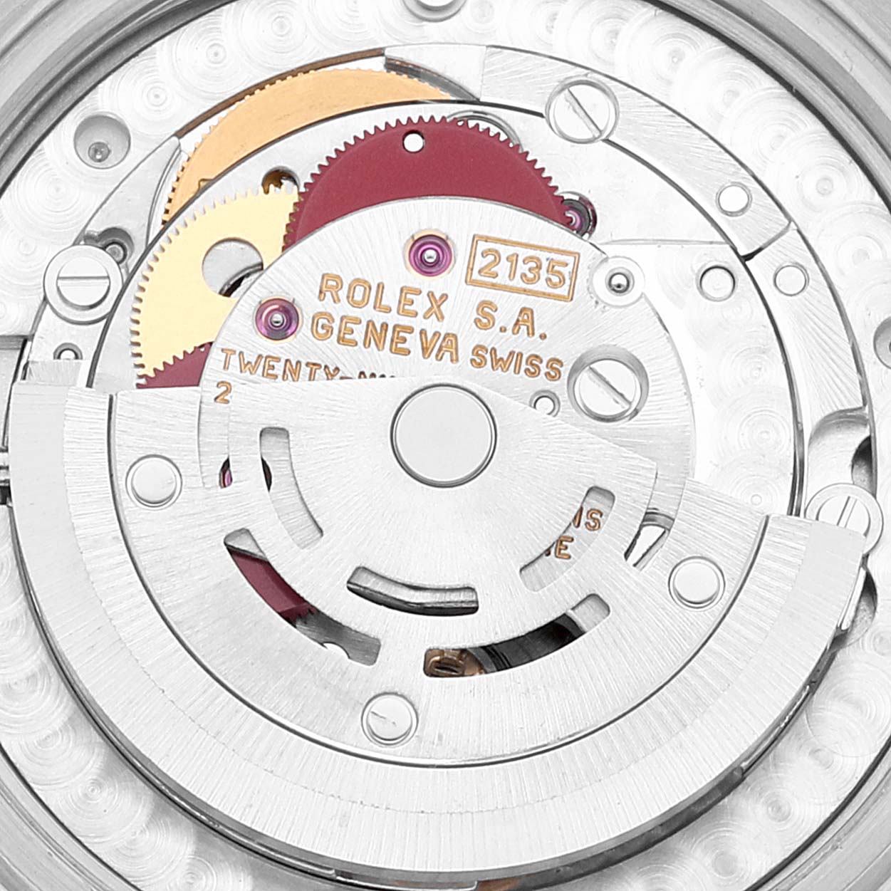 The image shows an interior view of a Mid-Size Rolex watch, focusing on its movement and mechanism components.