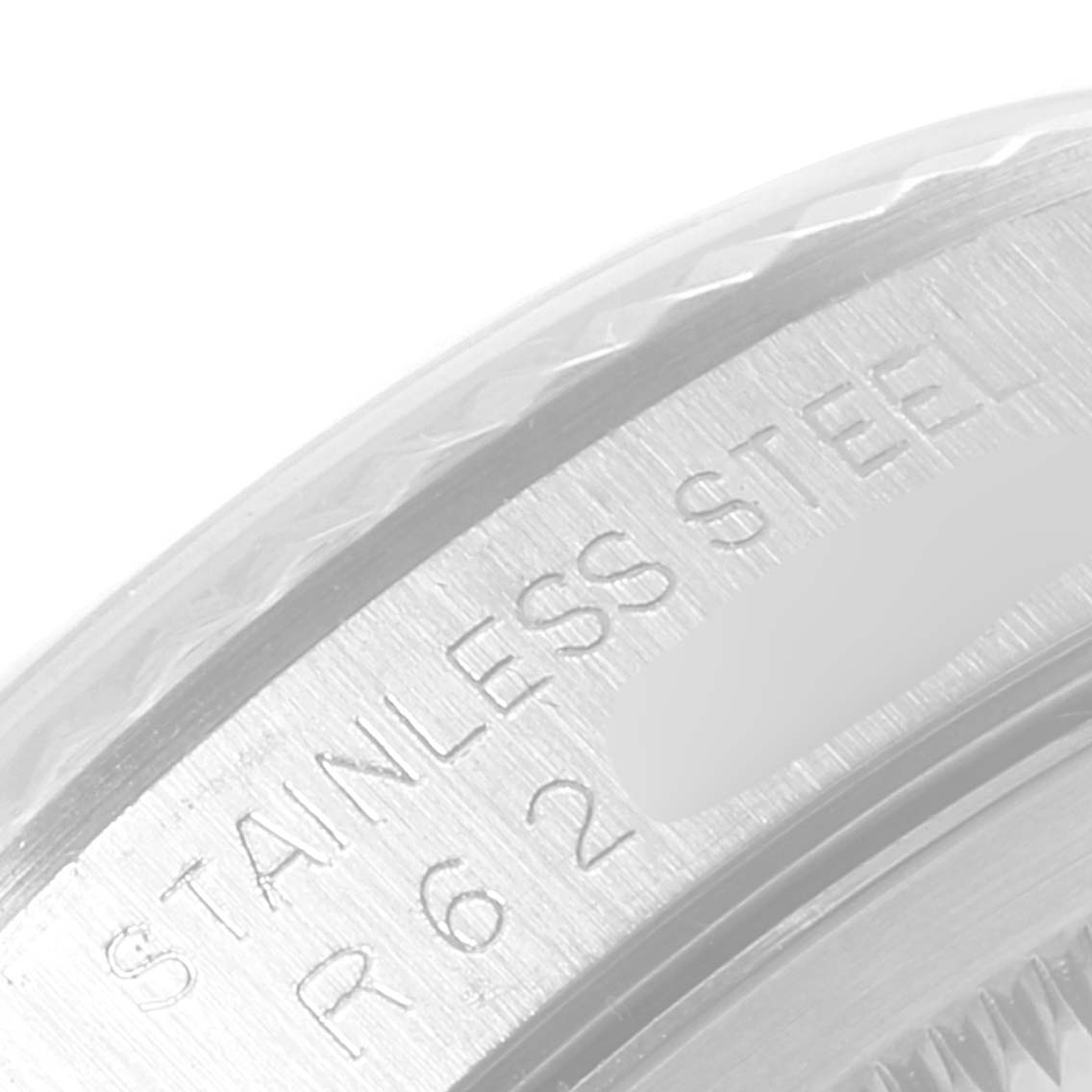 This is a close-up view of the stainless steel casing and engraved details of a Rolex Datejust 16234 Men's Stainless Steel Silver Dial 16234 Men's Stainless Steel Silver Dial watch.