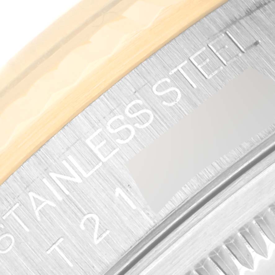 This close-up image shows the bezel and part of the caseback of a Rolex Datejust 16233 Men's Steel and Gold (two tone) Black Dial 16233 Men's Steel and Gold (two tone) Black Dial watch, highlighting the "STAINLESS STEEL" engraving.