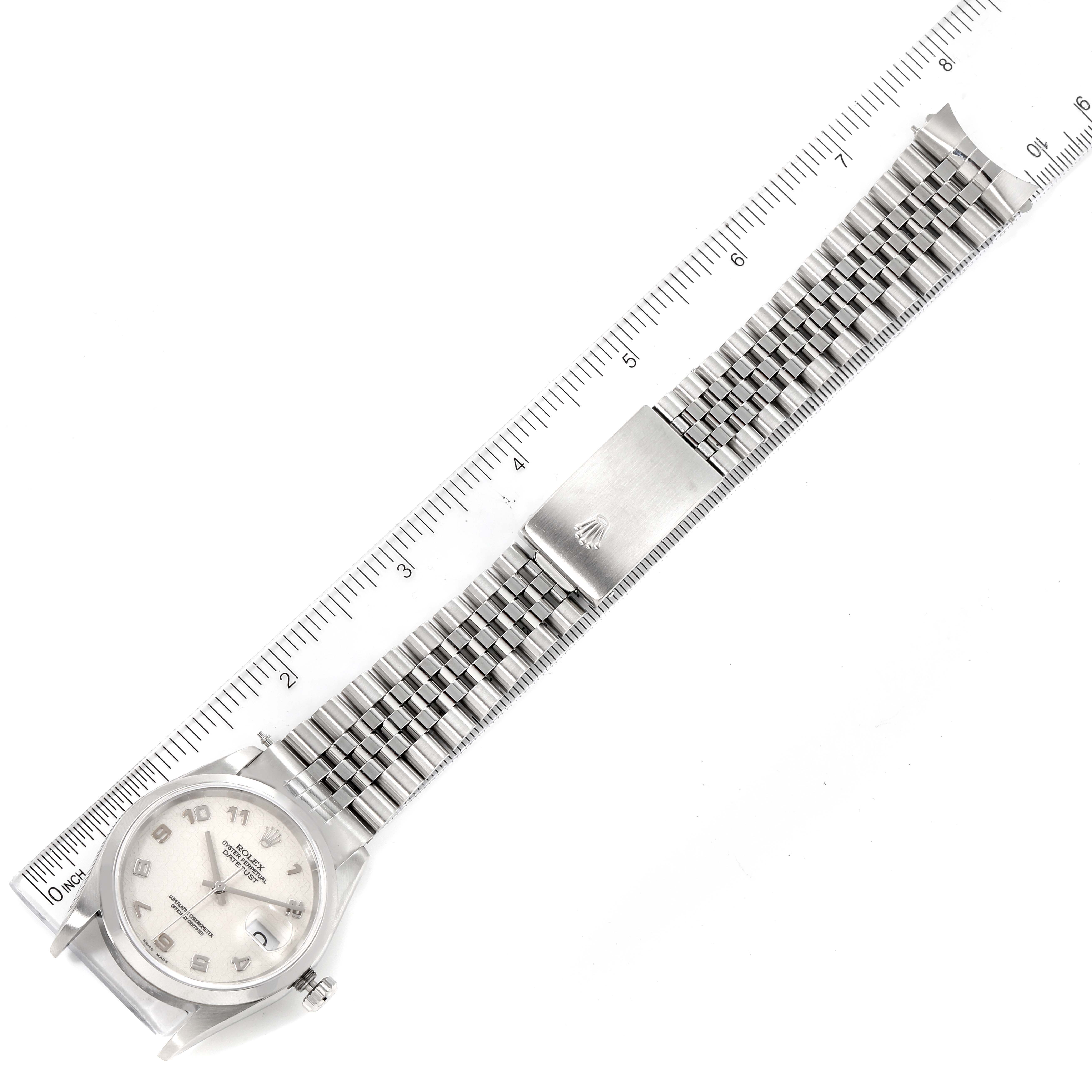 The image shows a Rolex Datejust 16200 Men's Stainless Steel Silver Dial 16200 Men's Stainless Steel Silver Dial watch laid flat, displaying the full length of the case, dial, and bracelet, alongside a ruler.