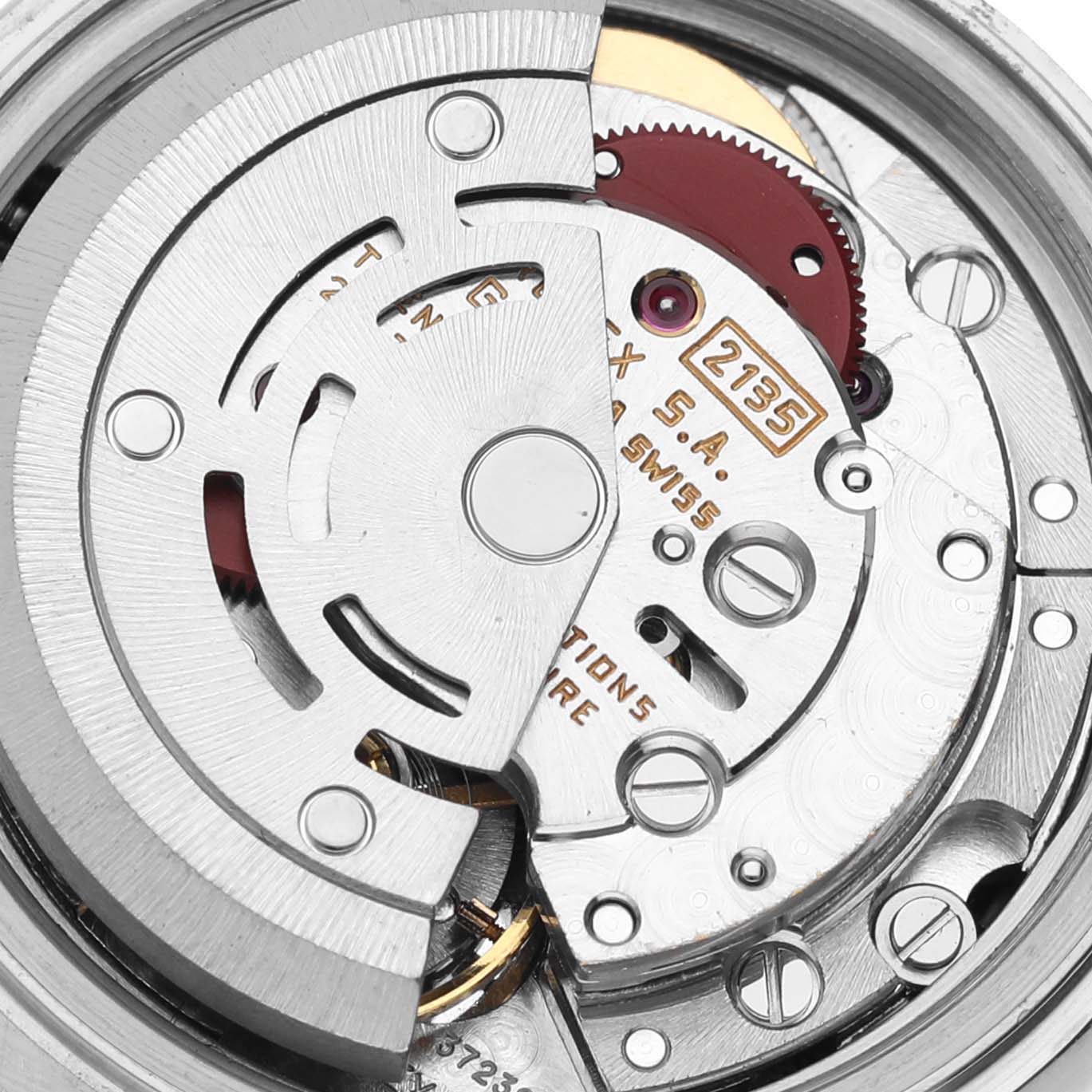 This image shows a close-up of the internal mechanism of the Rolex Datejust 69173 Women's Steel and Gold (two tone) Champagne Dial 69173 Women's Steel and Gold (two tone) Champagne Dial watch, highlighting gears and components.