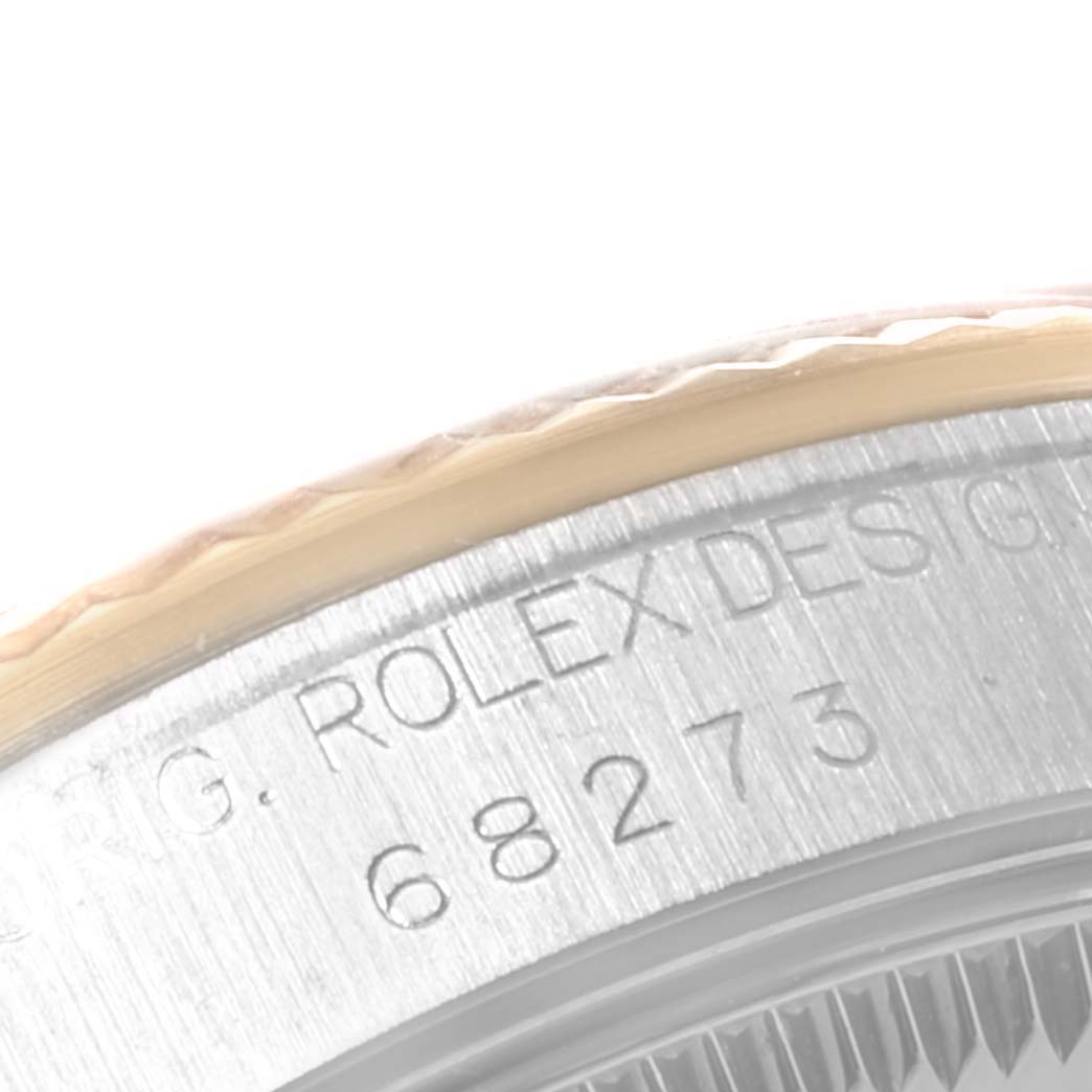 This close-up image shows the engraved case back of a Rolex Mid-Size 68273 Women
s Steel and Gold (two tone) Champagne Dial 68273 Women
s Steel and Gold (two tone) Champagne Dial model watch, revealing model number 68273.