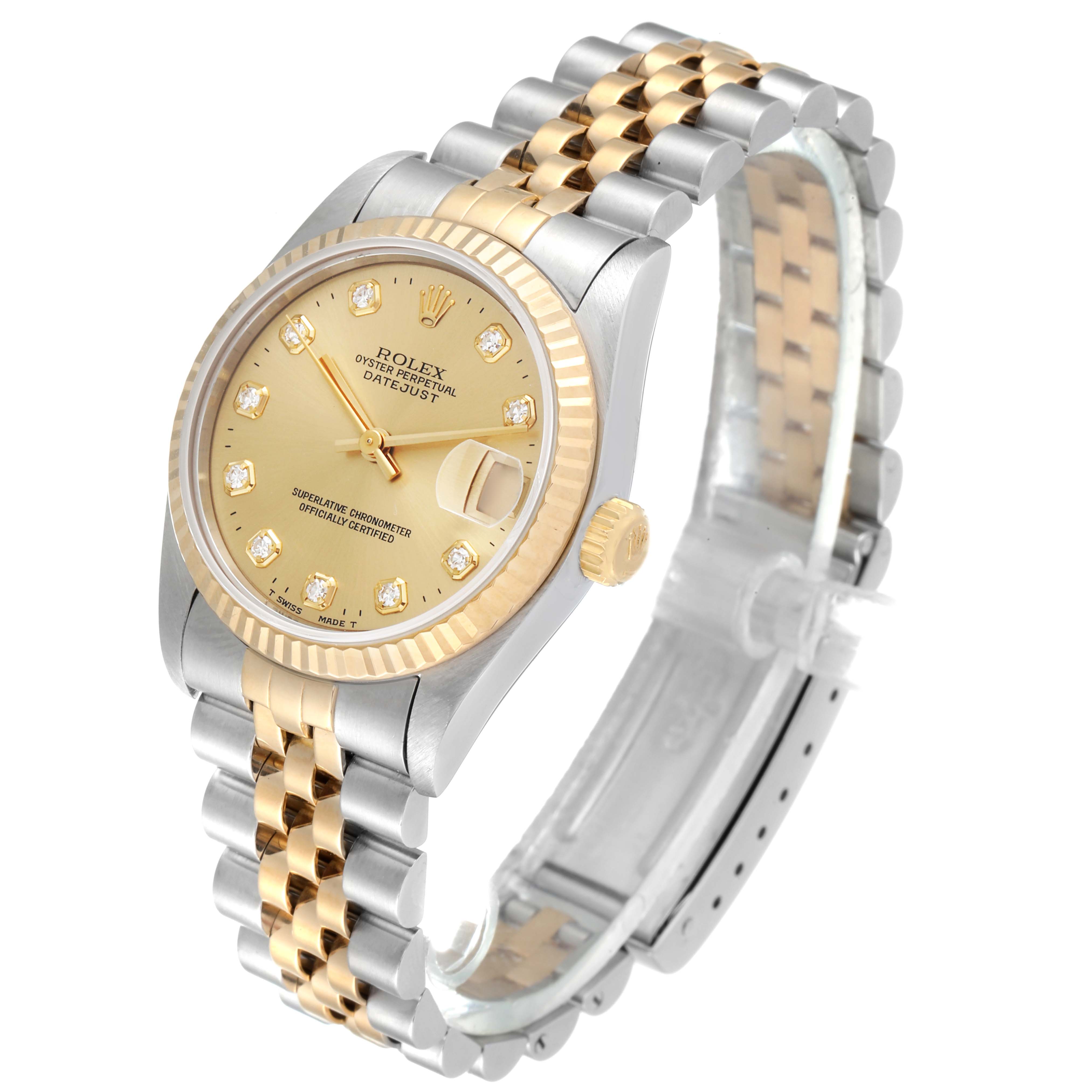 This Rolex Mid-Size 68273 Women
s Steel and Gold (two tone) Champagne Dial 68273 Women
s Steel and Gold (two tone) Champagne Dial watch is shown at a three-quarter angle, highlighting its two-tone bracelet, gold bezel, and champagne dial.