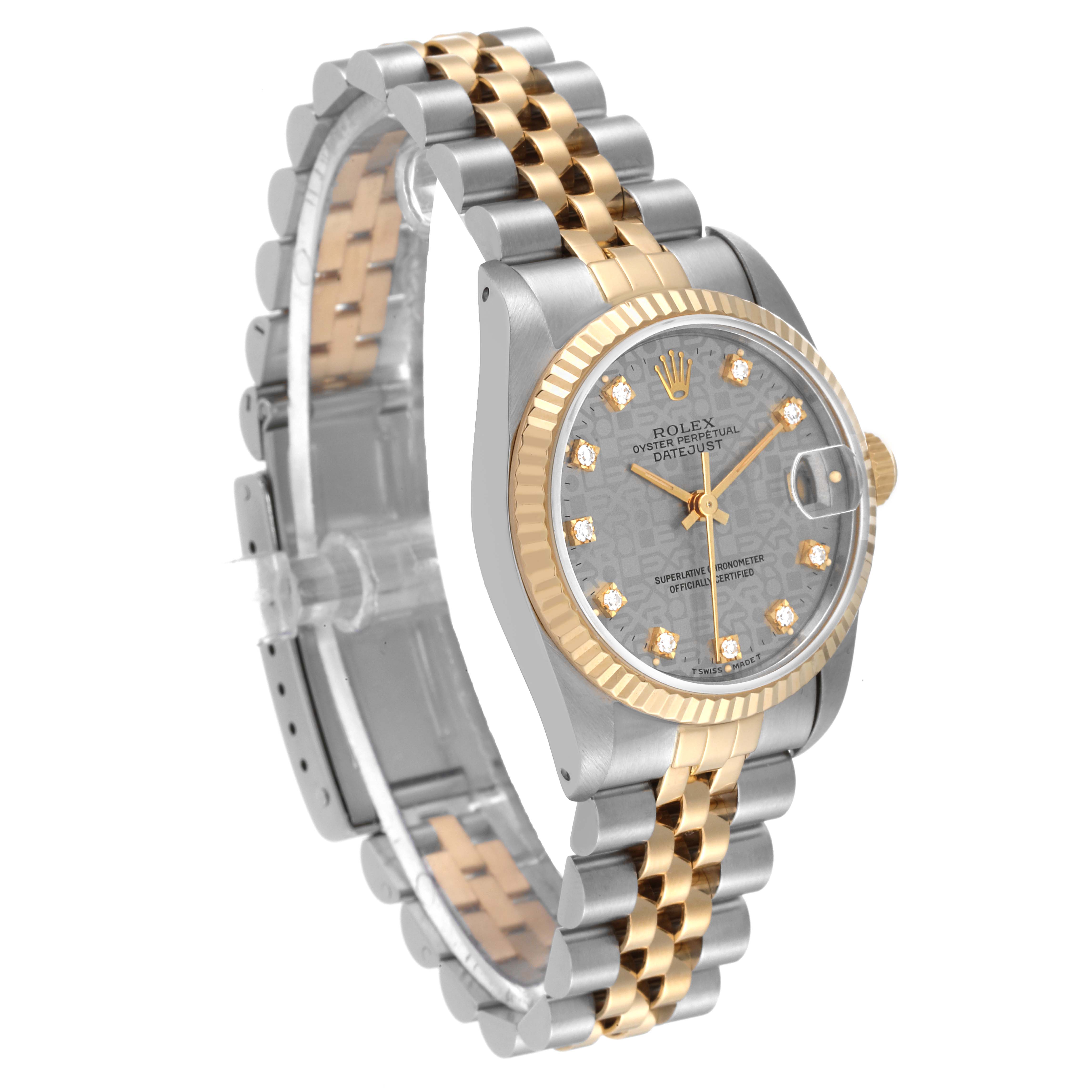 The image shows a side angle of a Rolex Mid-Size 68273 Women
s Steel and Gold (two tone) Silver Dial 68273 Women
s Steel and Gold (two tone) Silver Dial model watch, highlighting its two-tone bracelet and diamond-studded face.