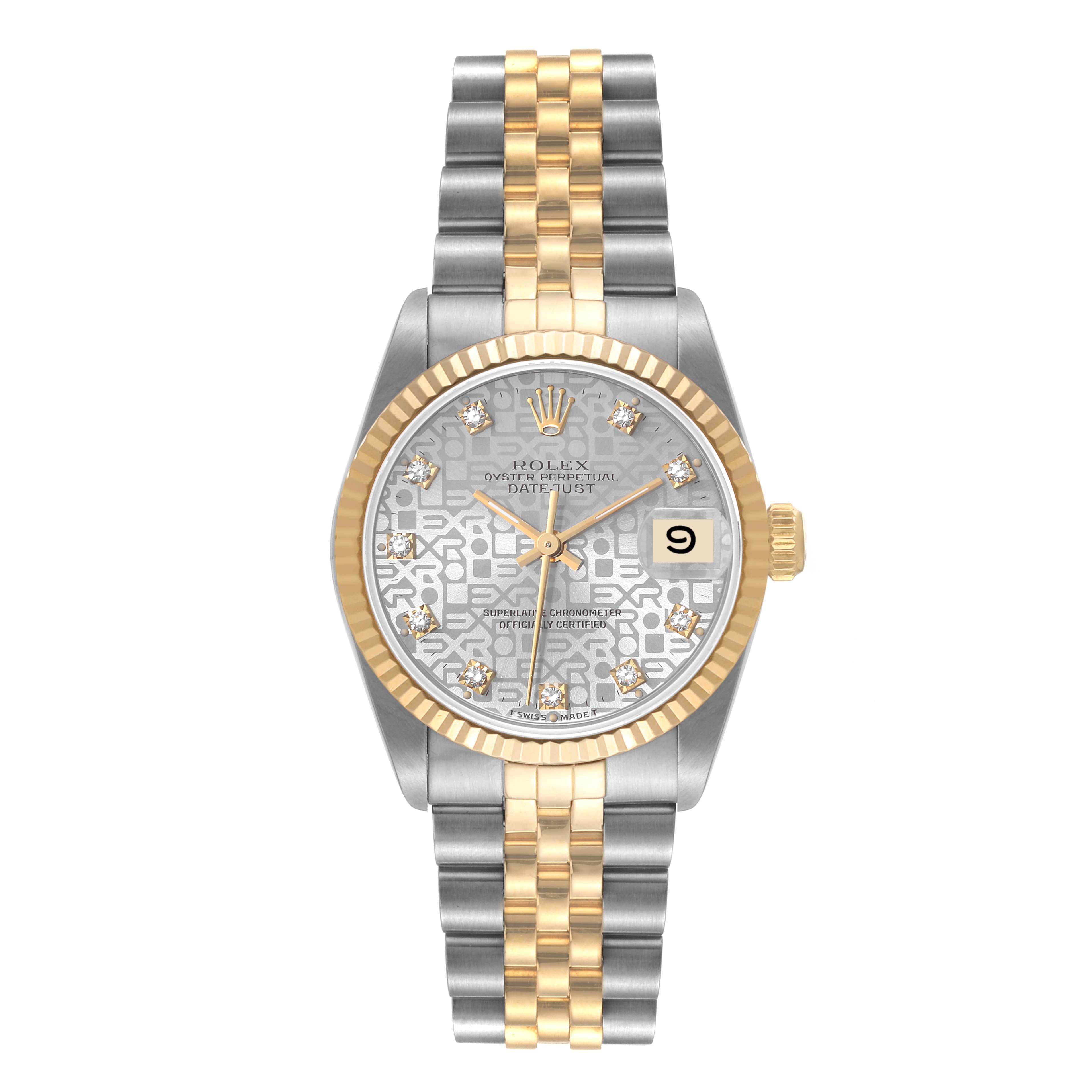 The image shows a front view of a Rolex Mid-Size 68273 Women
s Steel and Gold (two tone) Silver Dial 68273 Women
s Steel and Gold (two tone) Silver Dial Datejust with a two-tone bracelet and a patterned dial.
