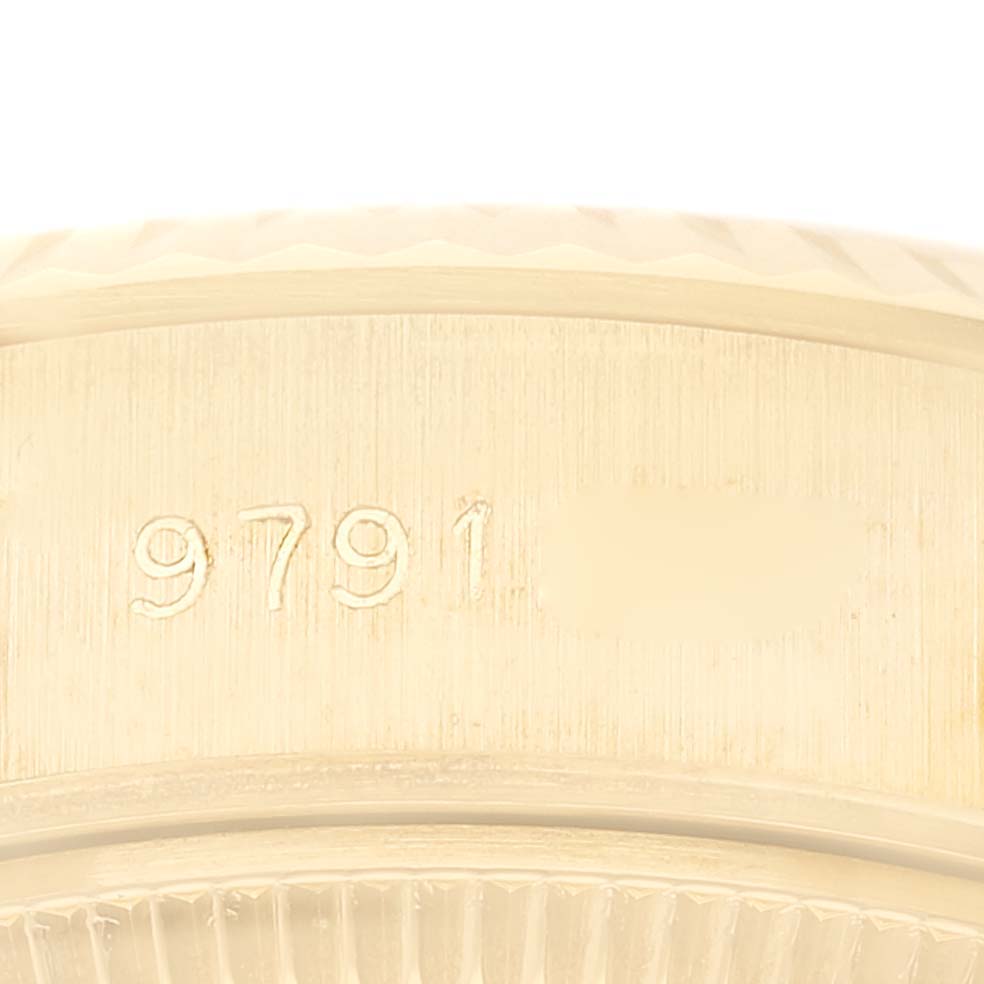 This image shows a close-up of the serial number engraving on the side of a Rolex President 69178 Women
s Yellow Gold Champagne Dial 69178 Women
s Yellow Gold Champagne Dial model watch.