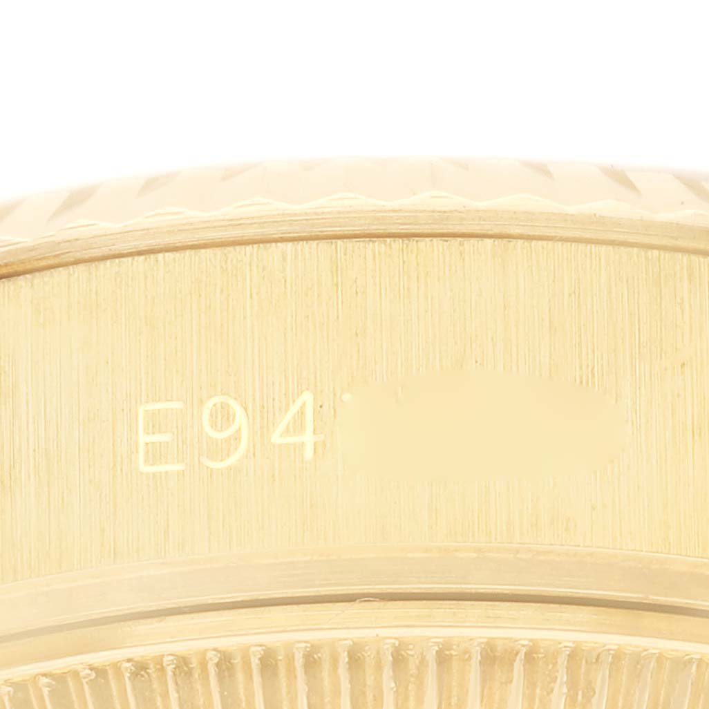 This image shows a close-up of the engraved serial number on the case side of a Rolex President 69178G Women's Yellow Gold Champagne Dial 69178G Women's Yellow Gold Champagne Dial model watch.