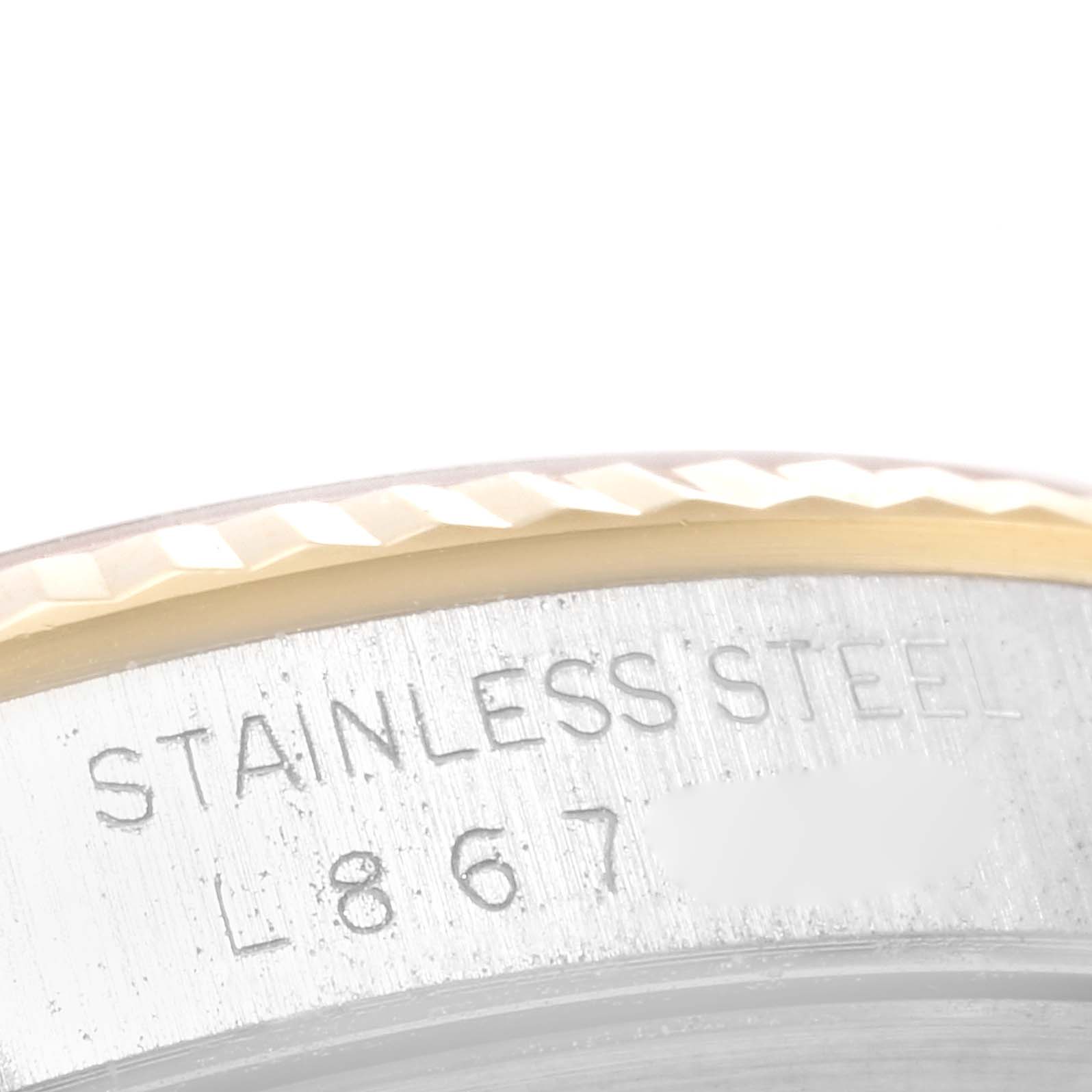 The image shows the side engraving on the stainless steel bezel of a Rolex Datejust 16233 Men
s Steel and Gold (two tone) Champagne Dial 16233 Men
s Steel and Gold (two tone) Champagne Dial watch.