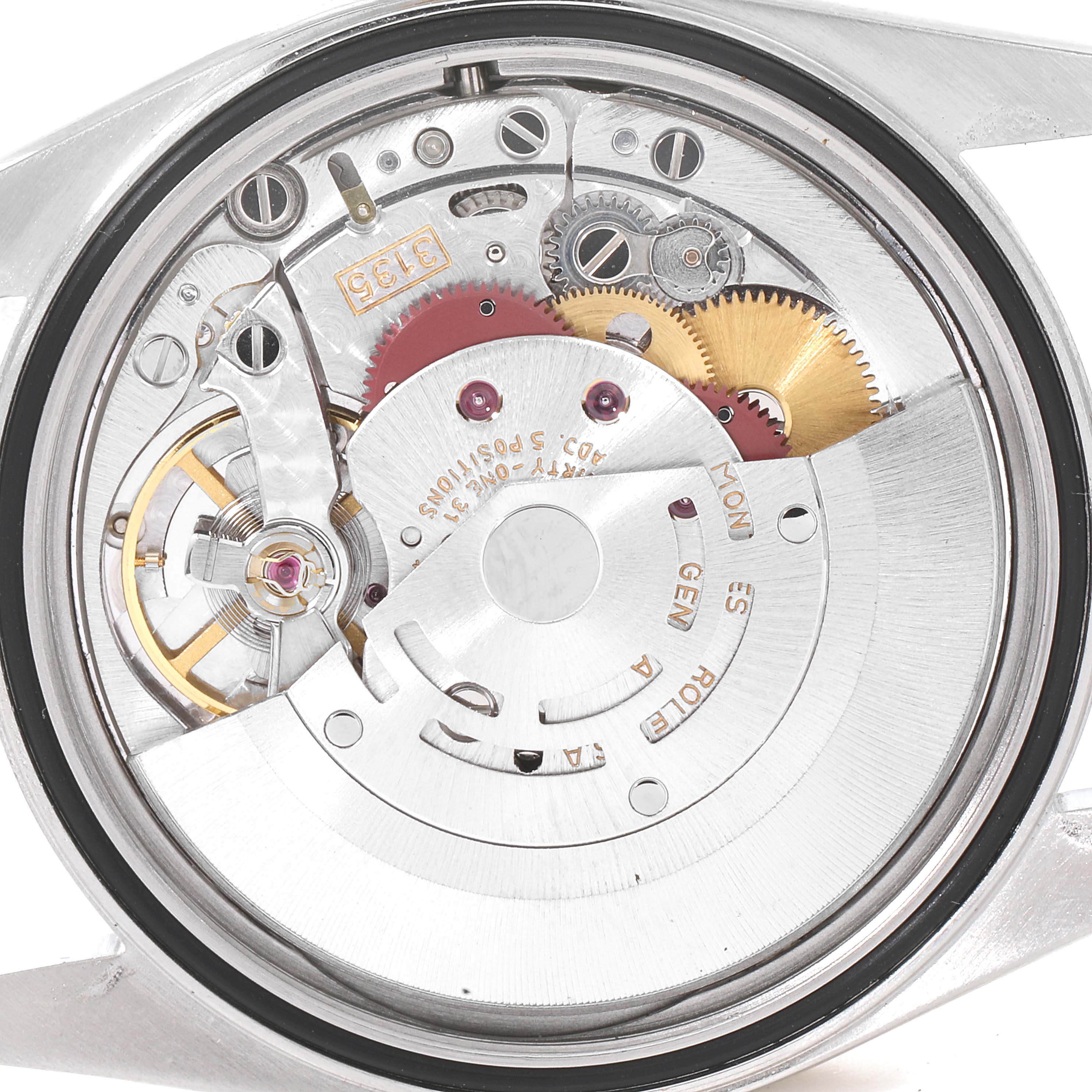 This image shows the intricate inner mechanism and movement of a Rolex Datejust 16233 Men
s Steel and Gold (two tone) Champagne Dial 16233 Men
s Steel and Gold (two tone) Champagne Dial watch from a rear angle, revealing gears and components.