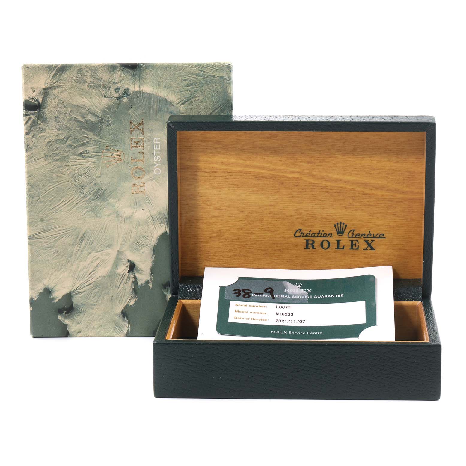 The image shows the packaging of a Rolex Datejust 16233 Men
s Steel and Gold (two tone) Champagne Dial 16233 Men
s Steel and Gold (two tone) Champagne Dial model watch, including the outer box, inner wooden box, and a service guarantee card.