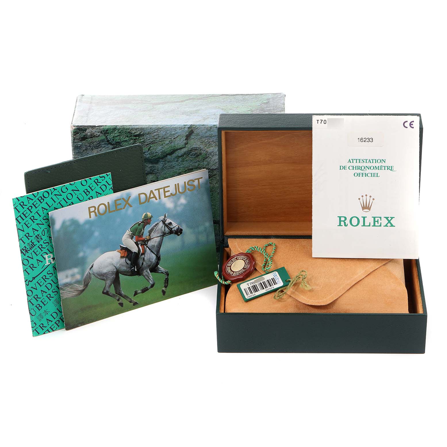 This image shows the packaging, certificates, and accessories for a Rolex Datejust 16233 Men's Steel and Gold (two tone) Black Dial 16233 Men's Steel and Gold (two tone) Black Dial watch, including the box, booklets, and tags.