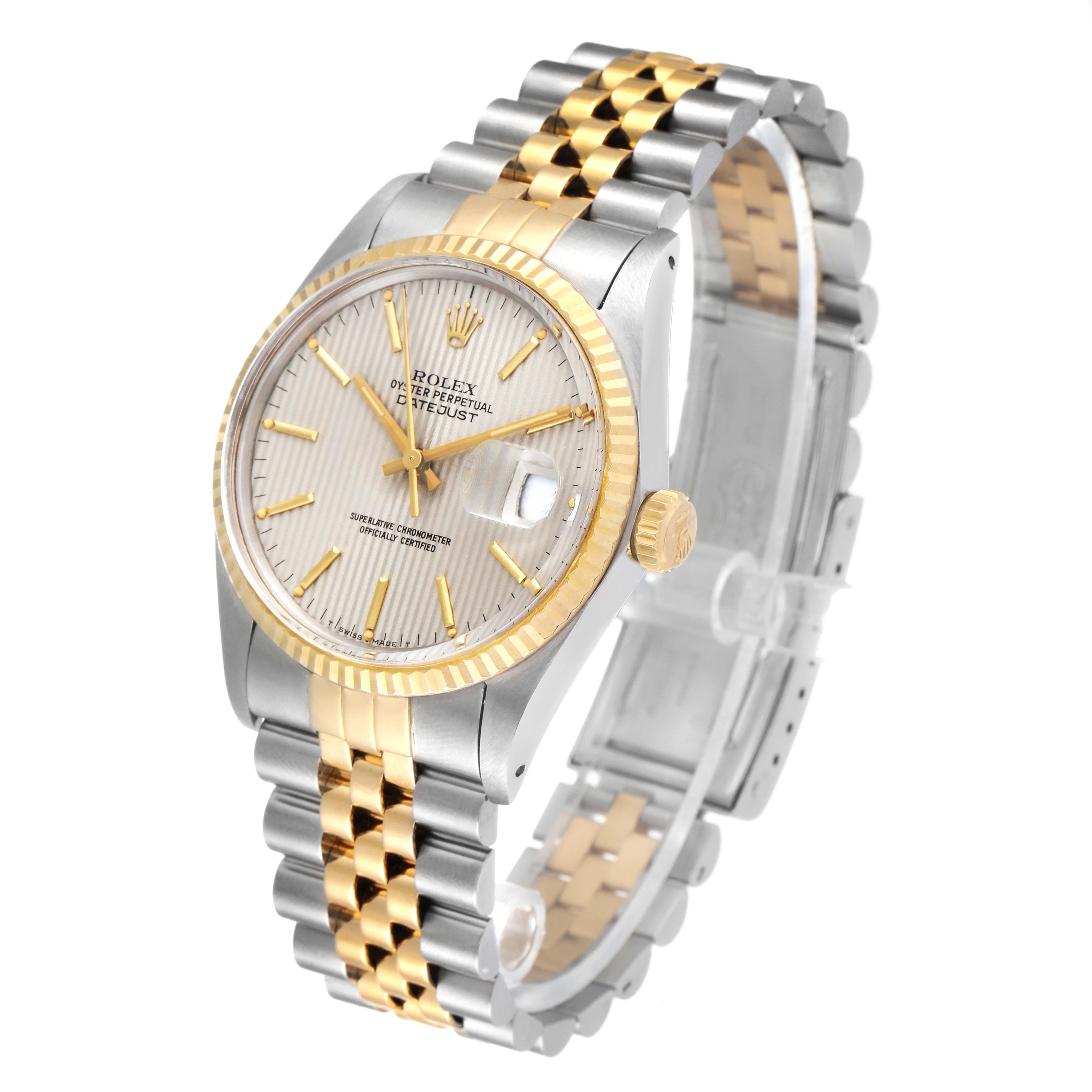 The image shows a Rolex Datejust 16013 Men's Steel and Gold (two tone) Silver Dial 16013 Men's Steel and Gold (two tone) Silver Dial watch at an oblique angle, highlighting its silver and gold jubilee bracelet, fluted bezel, and dial.