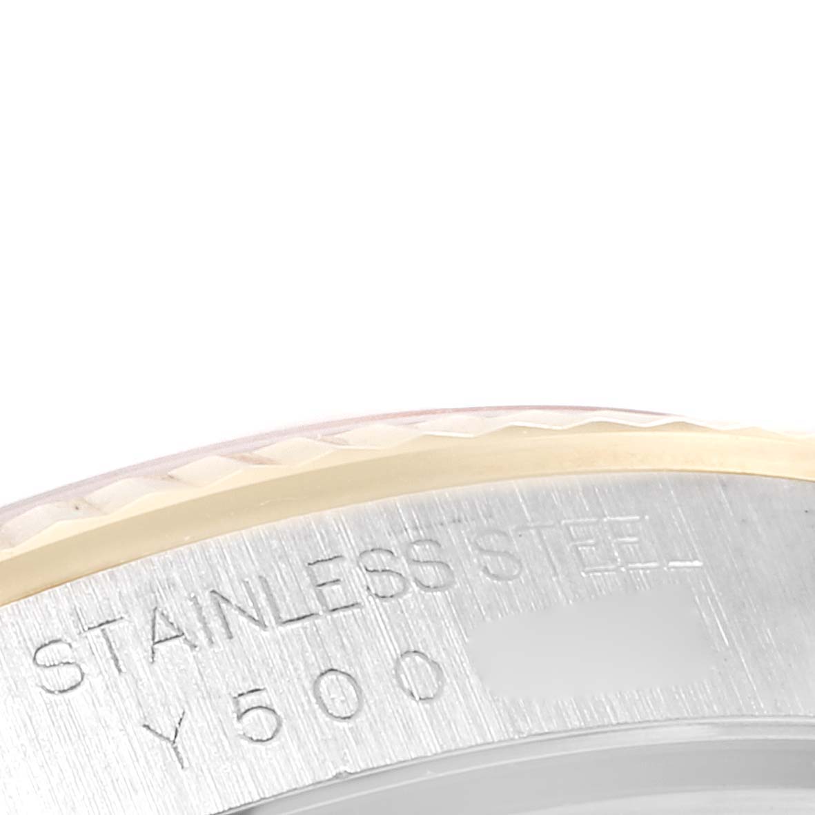 This image shows a close-up of the engraved text on the stainless steel bezel of a Rolex Datejust 16233 Men's Steel and Gold (two tone) White Dial 16233 Men's Steel and Gold (two tone) White Dial watch.