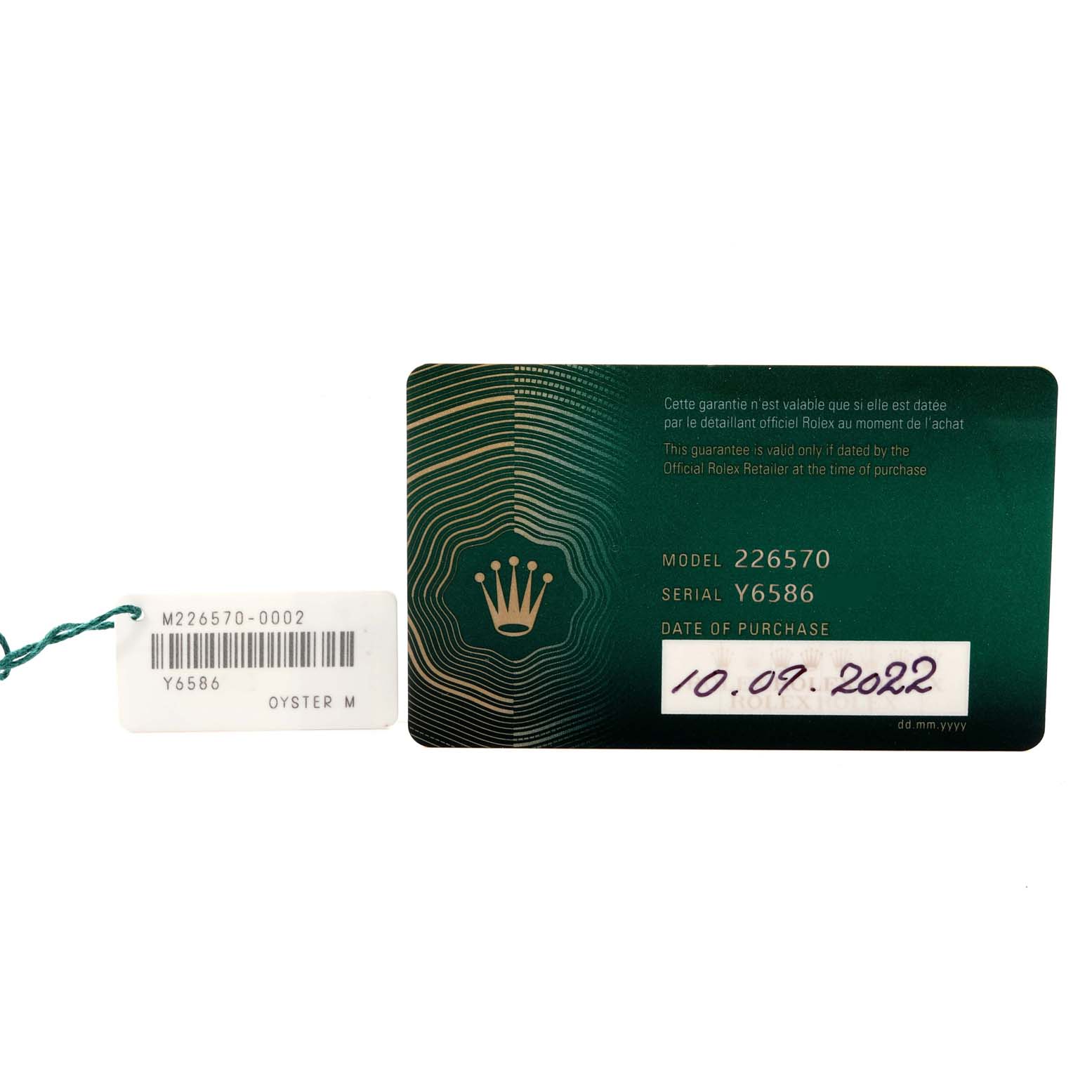 The image shows a Rolex Explorer 226570 Men
s Stainless Steel Black Dial 226570 Men
s Stainless Steel Black Dial model identification card and tag, displaying the model number, serial number, and purchase date.