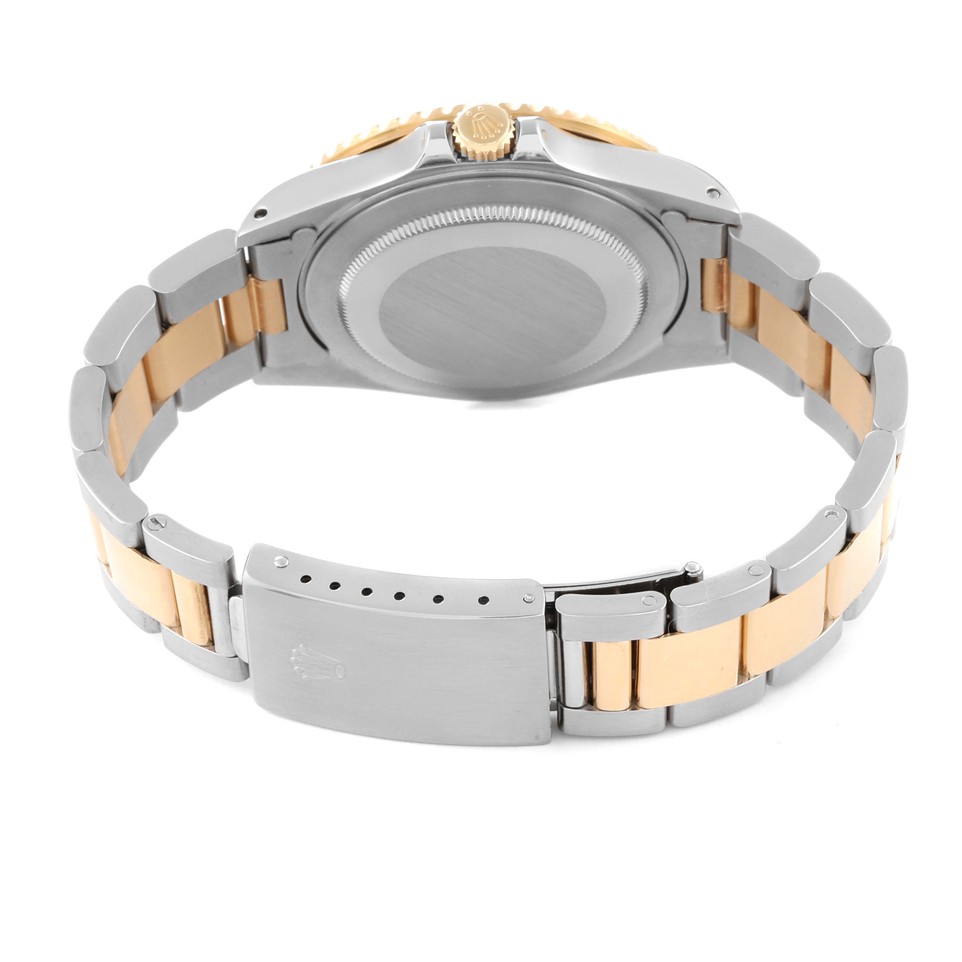 The image shows the backside and bracelet of the Rolex GMT-Master 16713 Men's Steel and Gold (two tone) Black Dial 16713 Men's Steel and Gold (two tone) Black Dial watch in a two-tone design.