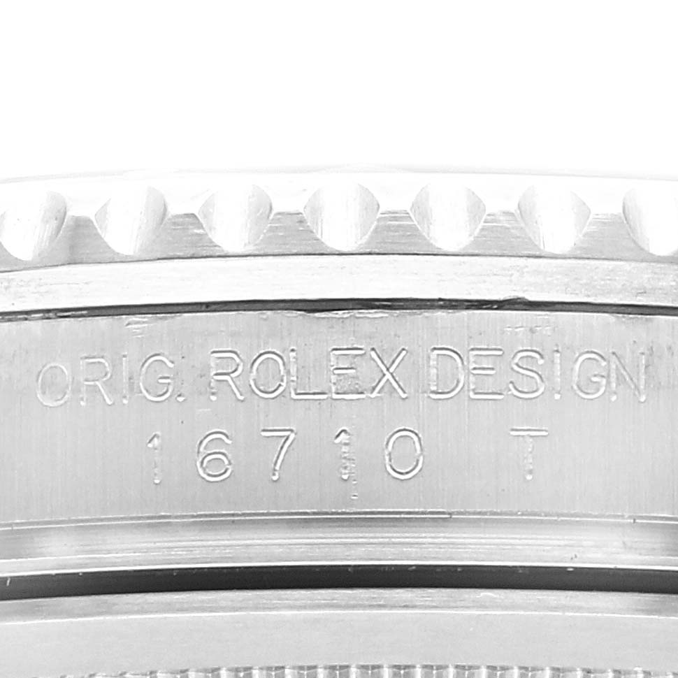 This image shows a close-up of the case side of a Rolex GMT-Master 16710 Men's Stainless Steel Black Dial 16710 Men's Stainless Steel Black Dial model, featuring the model number "16710 T" and "Orig. Rolex Design" engraving.