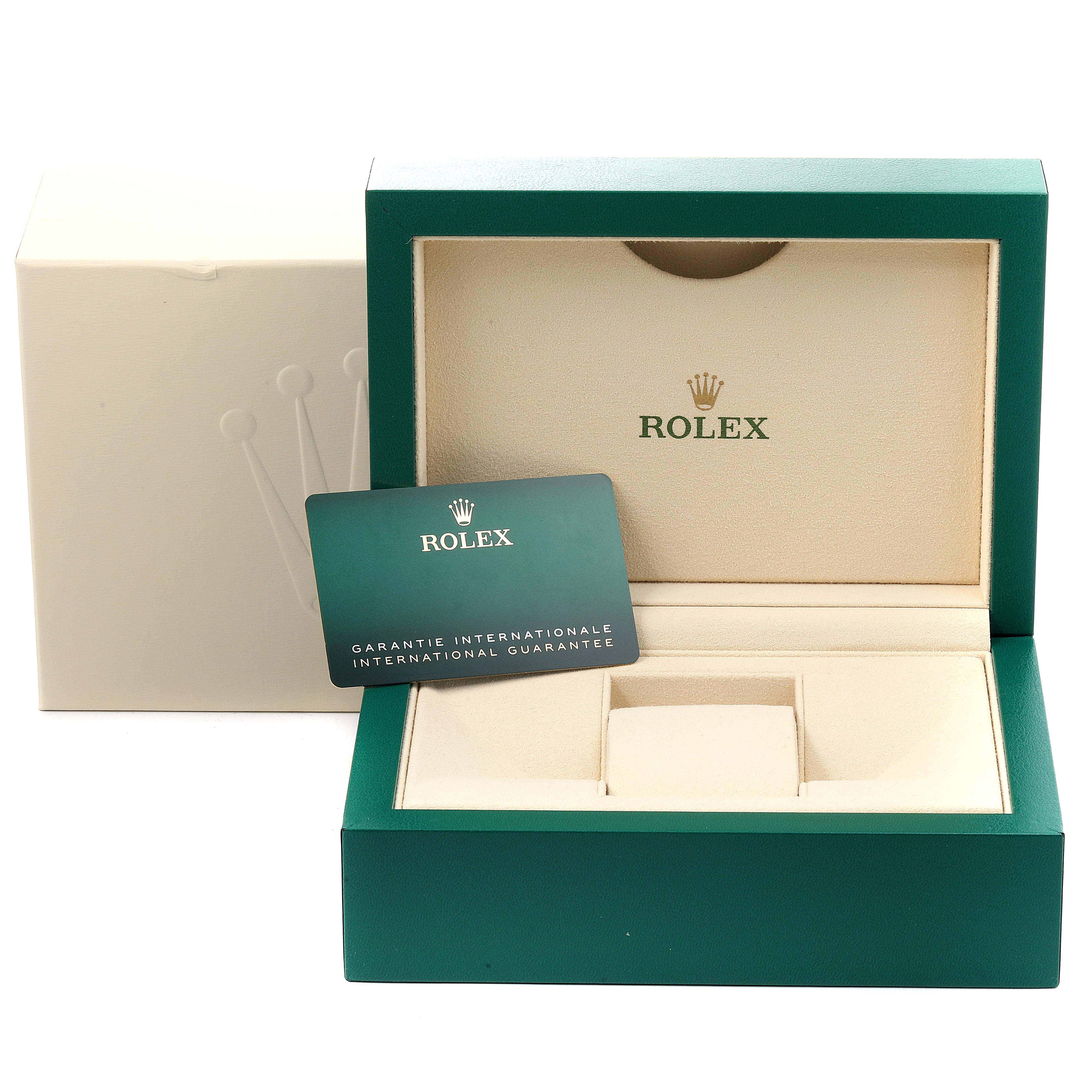 The image shows the packaging and guarantee card for a Rolex Milgauss 116400GV Men
s Stainless Steel Blue Dial 116400GV Men
s Stainless Steel Blue Dial watch, including the box and outer sleeve.