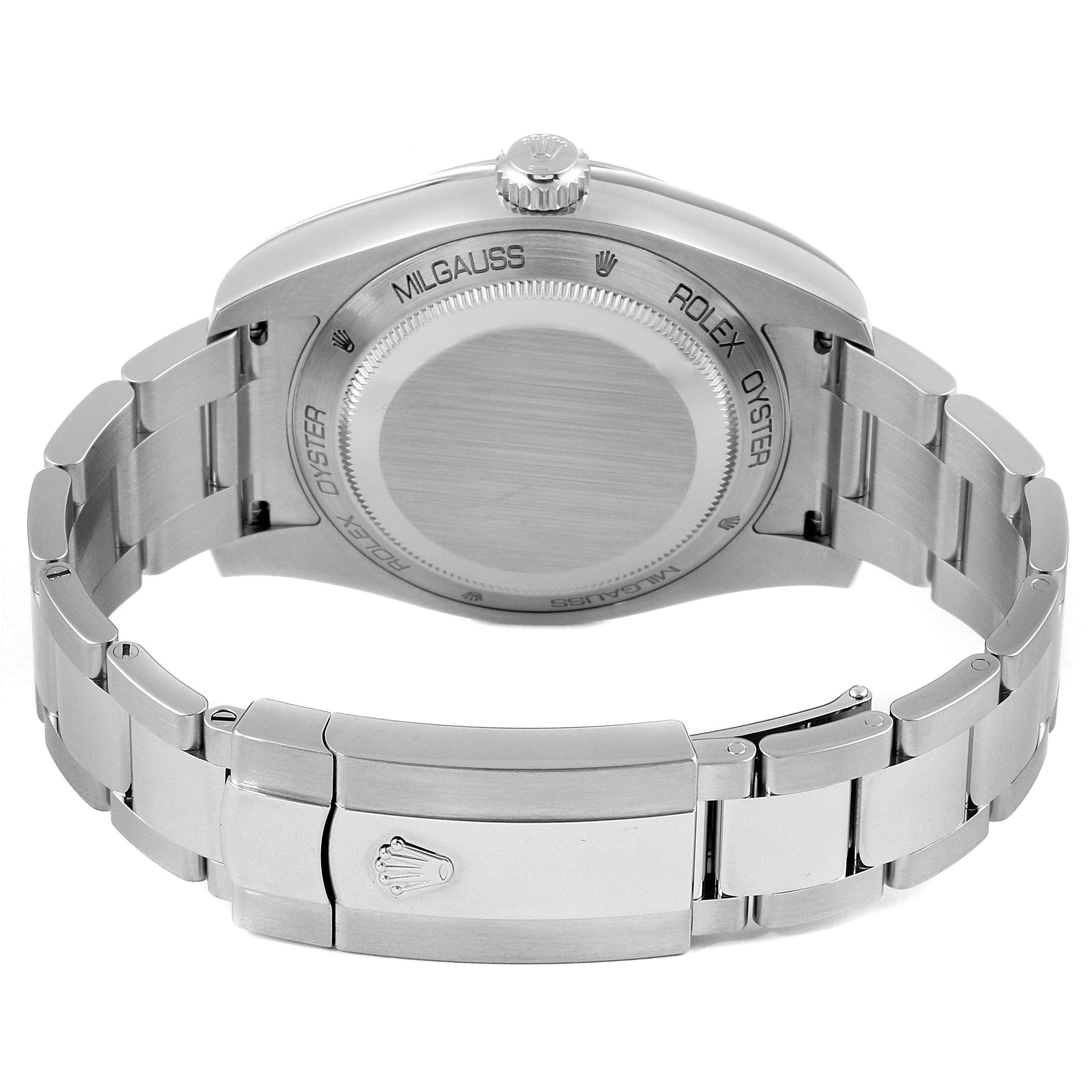 The image shows the back case and bracelet of the Rolex Milgauss 116400GV Men
s Stainless Steel Blue Dial 116400GV Men
s Stainless Steel Blue Dial watch, focusing on the clasp and caseback engravings at an angle.