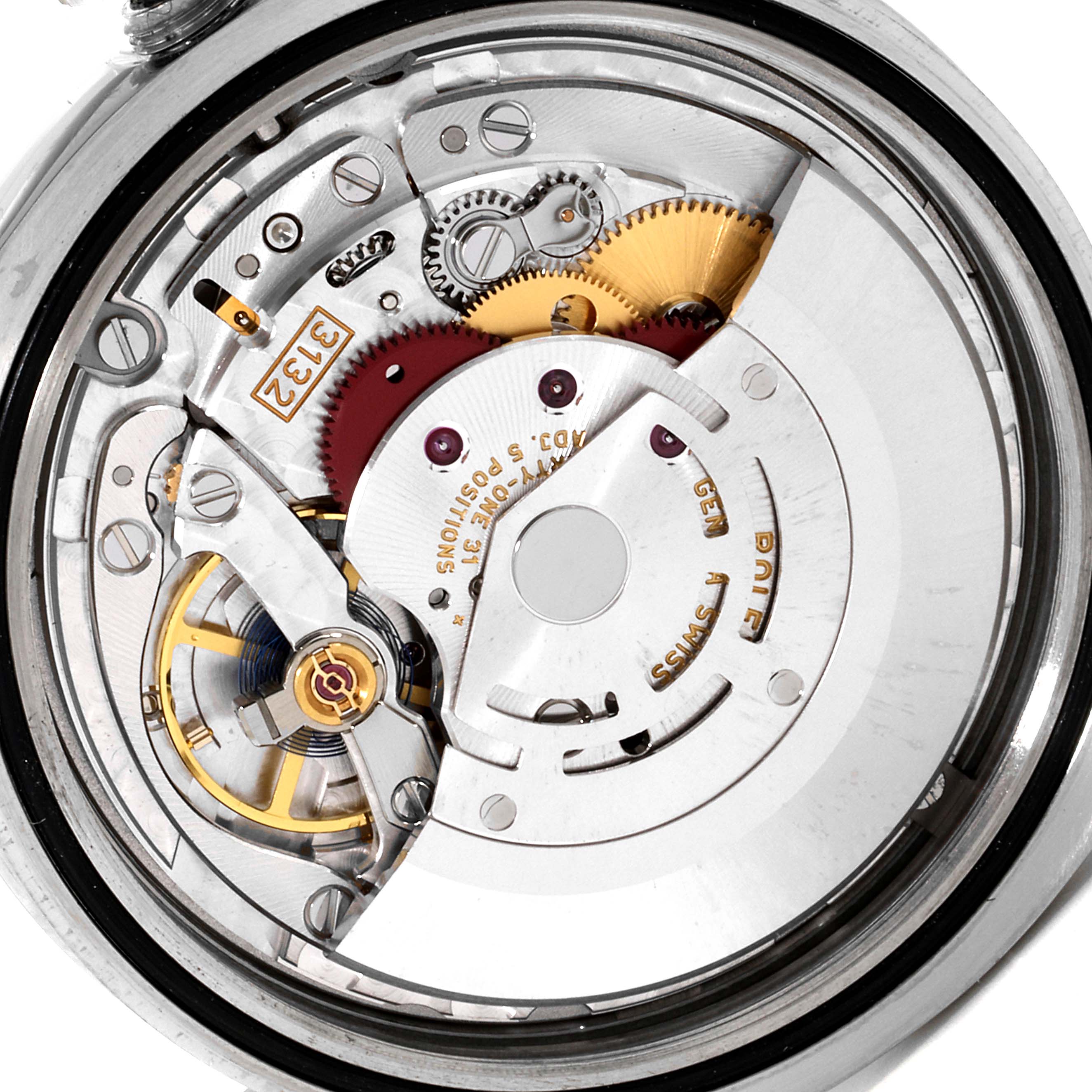 The image shows the intricate movement parts of a Rolex Oyster Perpetual 114300 Men's Stainless Steel Burgundy Dial 114300 Men's Stainless Steel Burgundy Dial watch from a back, open-case angle.