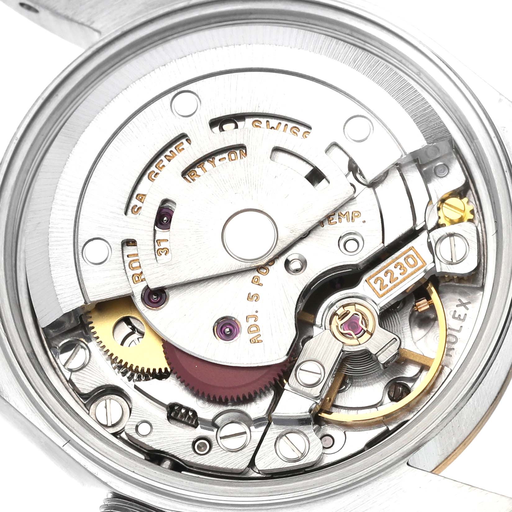 The image shows the exposed intricate movement and mechanism of a Rolex Datejust 76193 Women's Steel and Gold (two tone) Silver Dial 76193 Women's Steel and Gold (two tone) Silver Dial watch from a top-down angle.
