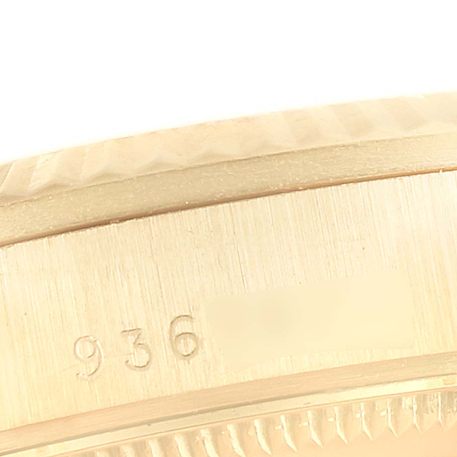 This image shows a close-up of the case side of a Rolex President 68278 Women's Yellow Gold Champagne Dial 68278 Women's Yellow Gold Champagne Dial watch, highlighting its serial number and part of the bezel.