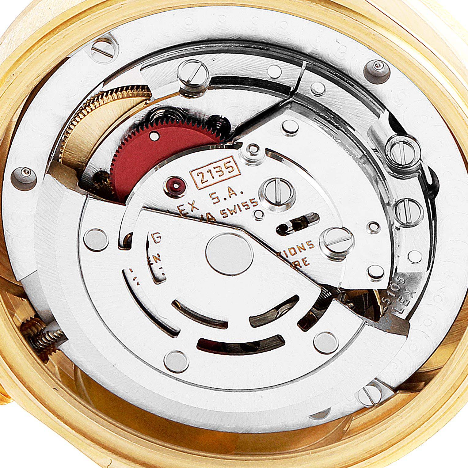 This image shows the intricate movement mechanism of a Rolex President 68278 Women
s Yellow Gold Champagne Dial 68278 Women
s Yellow Gold Champagne Dial model watch from a close-up, top-down angle.
