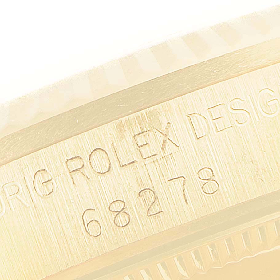 The image shows a close-up of the serial number engraving on the case side of a Rolex President 68278 Women
s Yellow Gold Champagne Dial 68278 Women
s Yellow Gold Champagne Dial model watch.