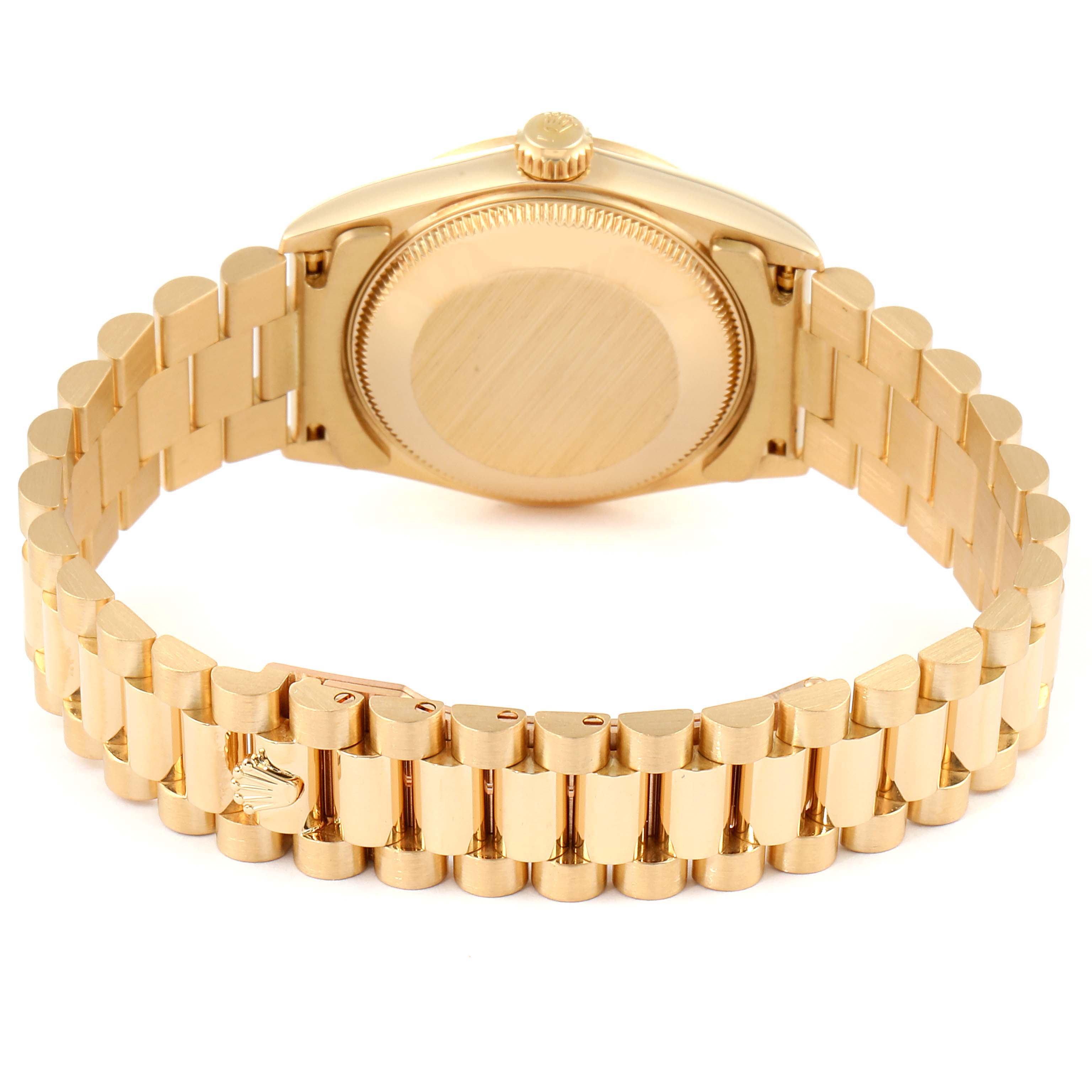 This image shows the backside of a Rolex President 68278 Women
s Yellow Gold Champagne Dial 68278 Women
s Yellow Gold Champagne Dial model watch, focusing on the case back and bracelet.