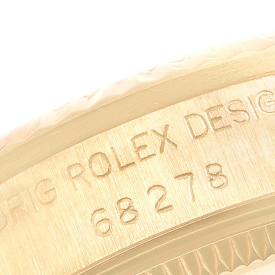 The close-up image shows the engraved model number and part of the bezel of a Rolex President 68278 Women
s Yellow Gold Champagne Dial 68278 Women
s Yellow Gold Champagne Dial watch.