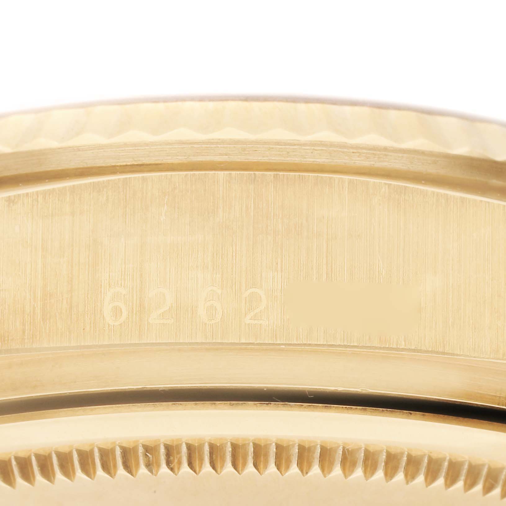 This close-up image shows the edge of the case and part of the bezel of a Rolex President 18038 Men
s Yellow Gold Champagne Dial 18038 Men
s Yellow Gold Champagne Dial model watch, highlighting its reference number.