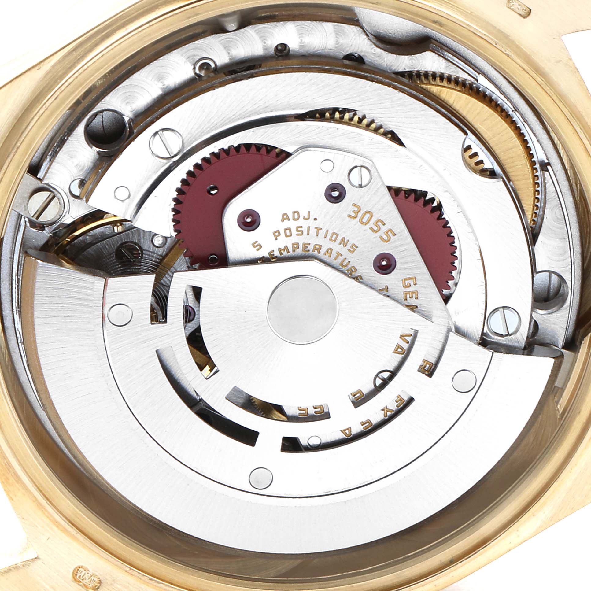 The image displays a close-up of the movement mechanism of a Rolex President 18048 Men
s Yellow Gold Champagne Dial 18048 Men
s Yellow Gold Champagne Dial model watch, showing gears and other internal components.