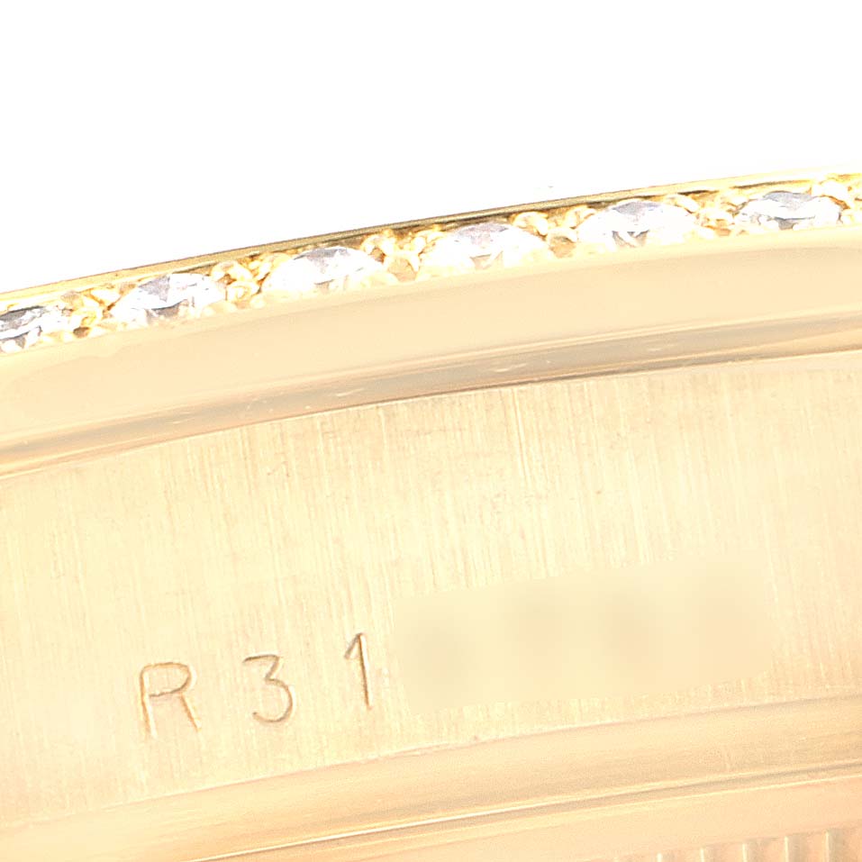 Close-up of the bezel and serial number engraving on a Rolex President 18048 Men
s Yellow Gold Champagne Dial 18048 Men
s Yellow Gold Champagne Dial model watch.
