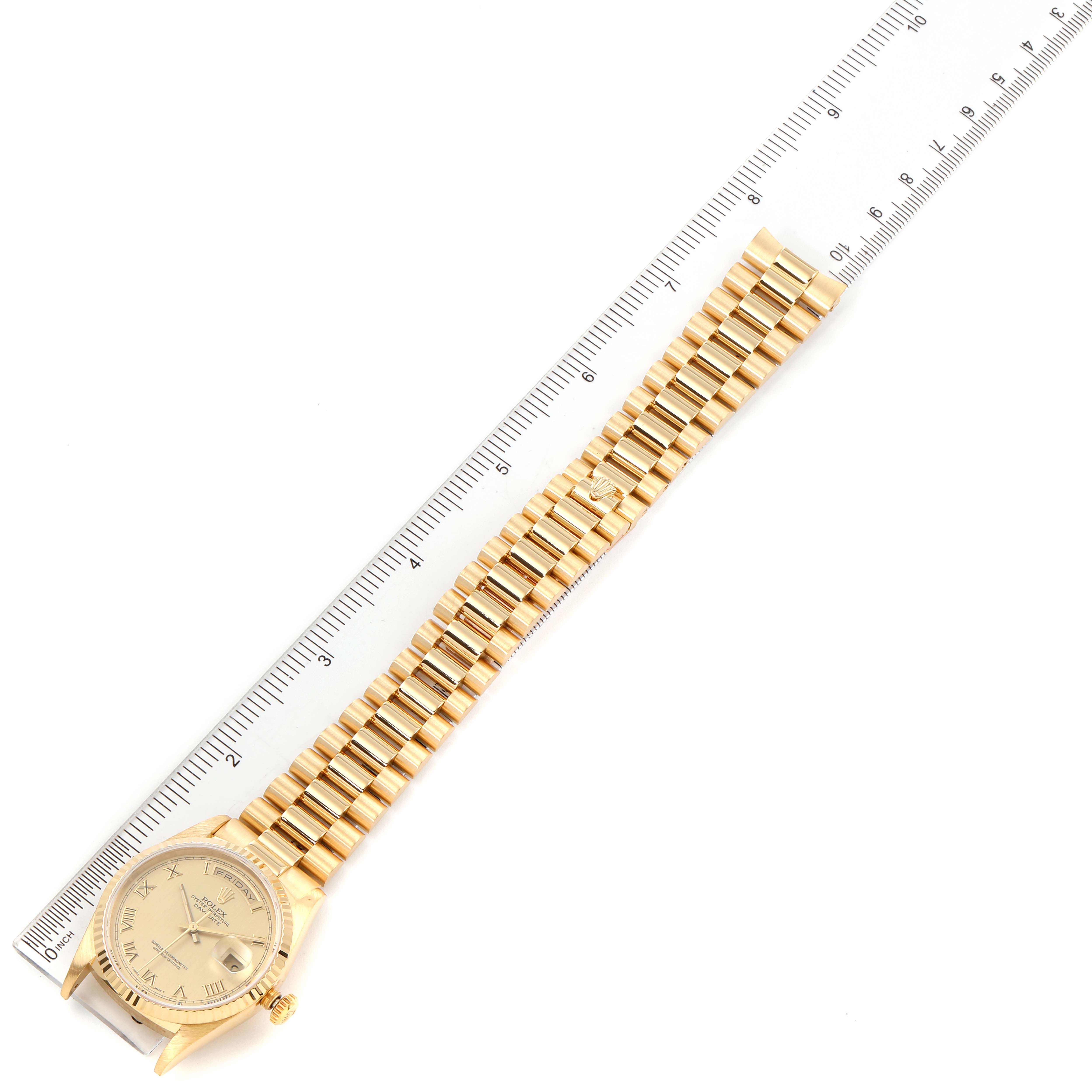 The image shows a Rolex President 18238 Men's Yellow Gold Champagne Dial 18238 Men's Yellow Gold Champagne Dial model watch laid flat with a ruler beside it for scale.