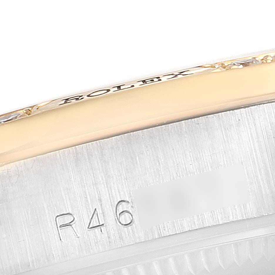 This image shows a close-up of the side of a Rolex President 68149 Women's White Gold Brown Dial 68149 Women's White Gold Brown Dial model watch, highlighting the engraved brand name and part of the serial number.