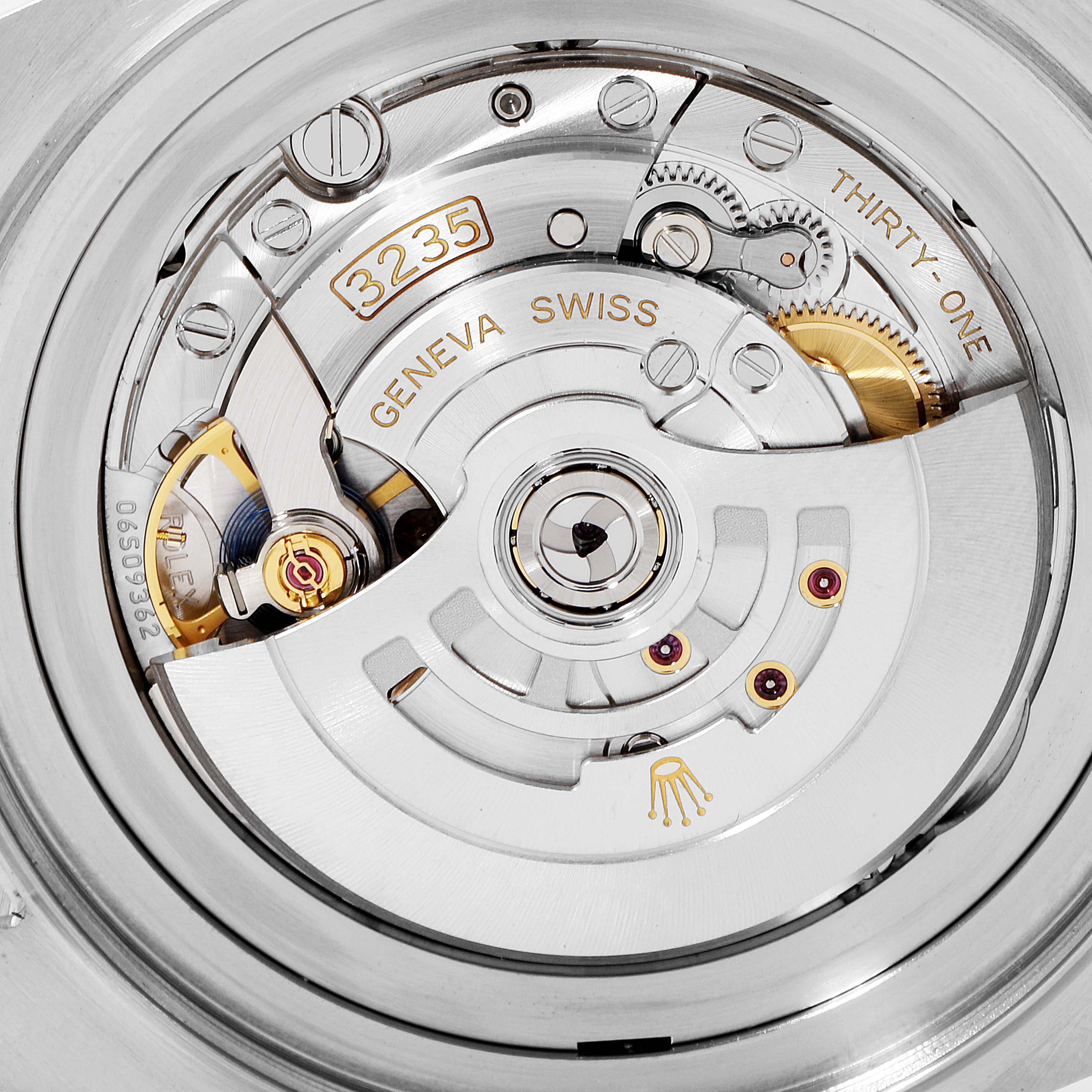 The image shows the internal movement mechanism of a Rolex Sea-Dweller 126660 Men
s Stainless Steel Black Dial 126660 Men
s Stainless Steel Black Dial model, prominently displaying gears and the rotor.