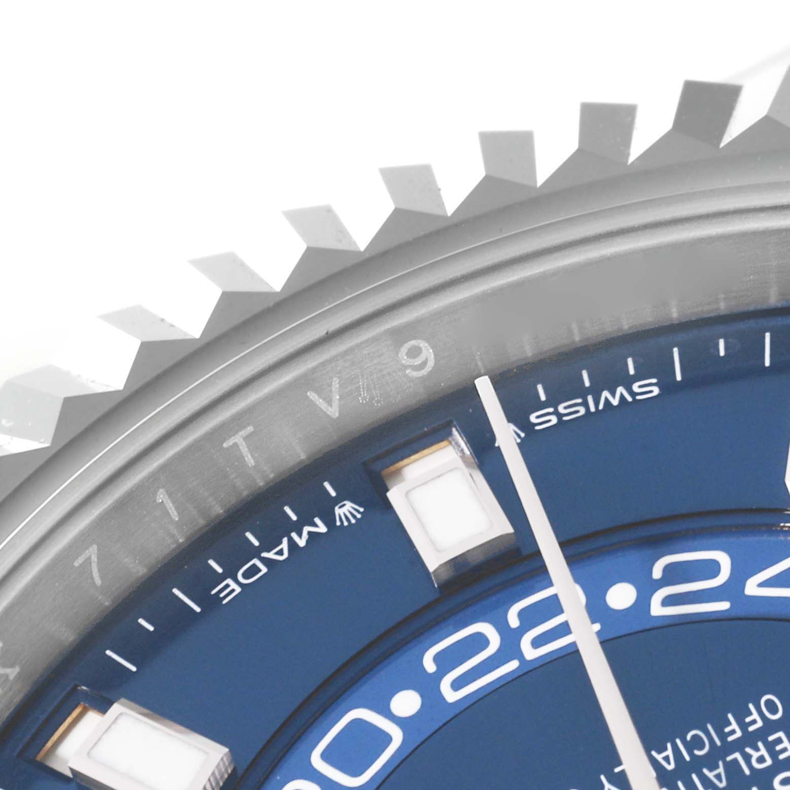 The image shows a close-up of the bezel and part of the blue dial of a Rolex Sky-Dweller 336934 Men
s Stainless Steel Blue Dial 336934 Men
s Stainless Steel Blue Dial watch, focusing on the Swiss-made label and markers.