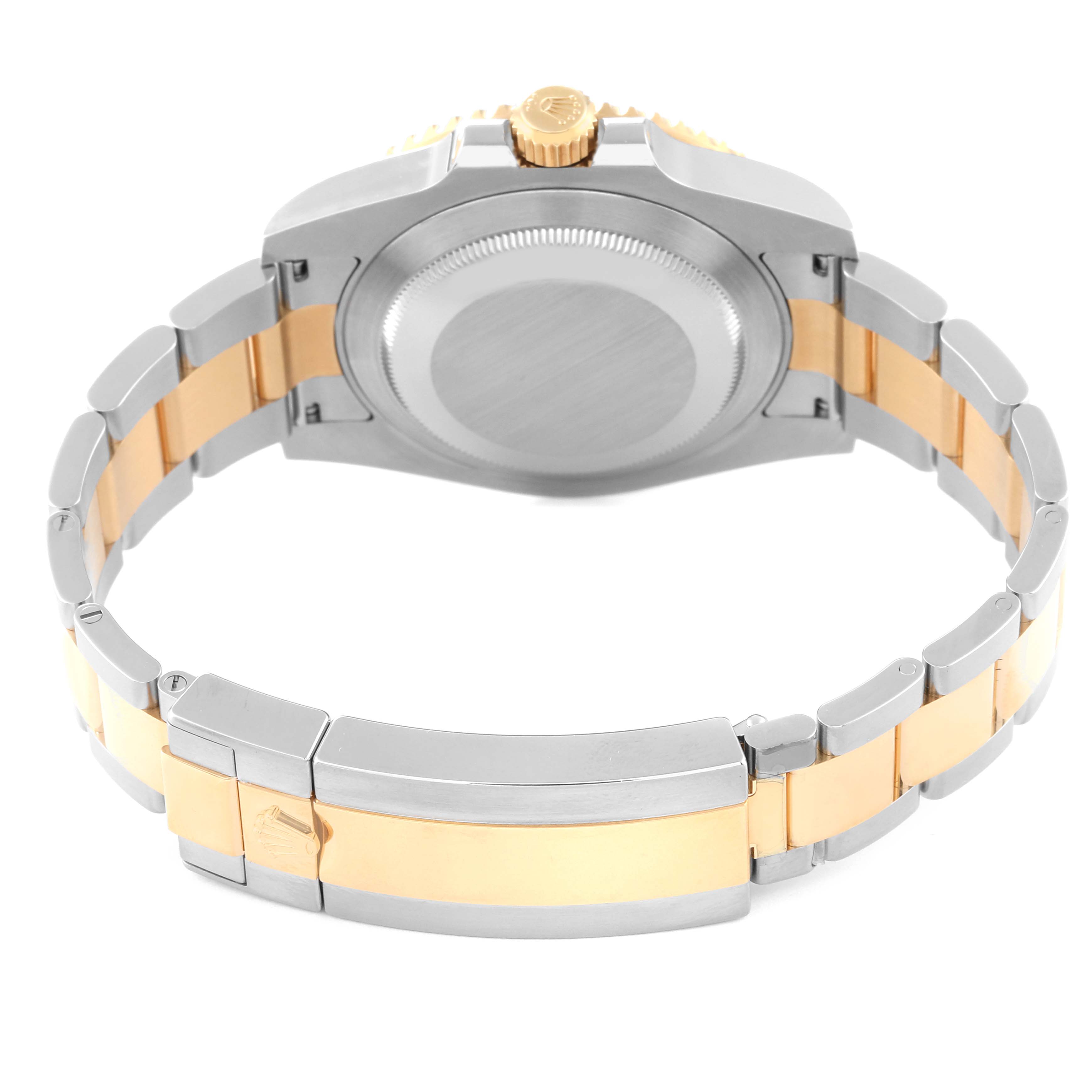 This image shows the back and bracelet of a Rolex Submariner 116613LN Men
s Steel and Gold (two tone) Black Dial 116613LN Men
s Steel and Gold (two tone) Black Dial watch, featuring a two-tone metal design.