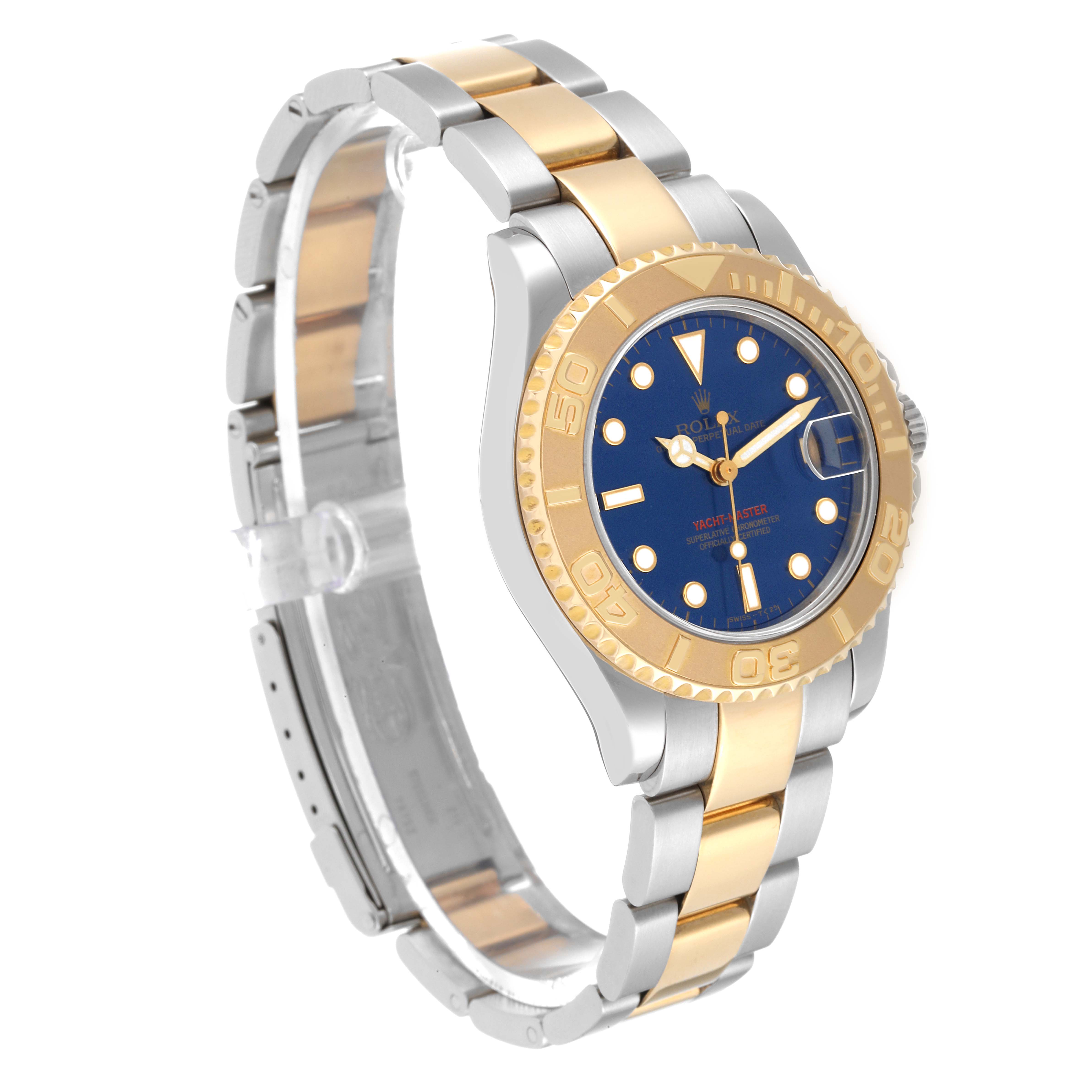 The Rolex Yacht-Master 68623 Men's Steel and Gold (two tone) Blue Dial 68623 Men's Steel and Gold (two tone) Blue Dial watch is shown at a three-quarter view, highlighting its two-tone bracelet, blue dial, and gold bezel.