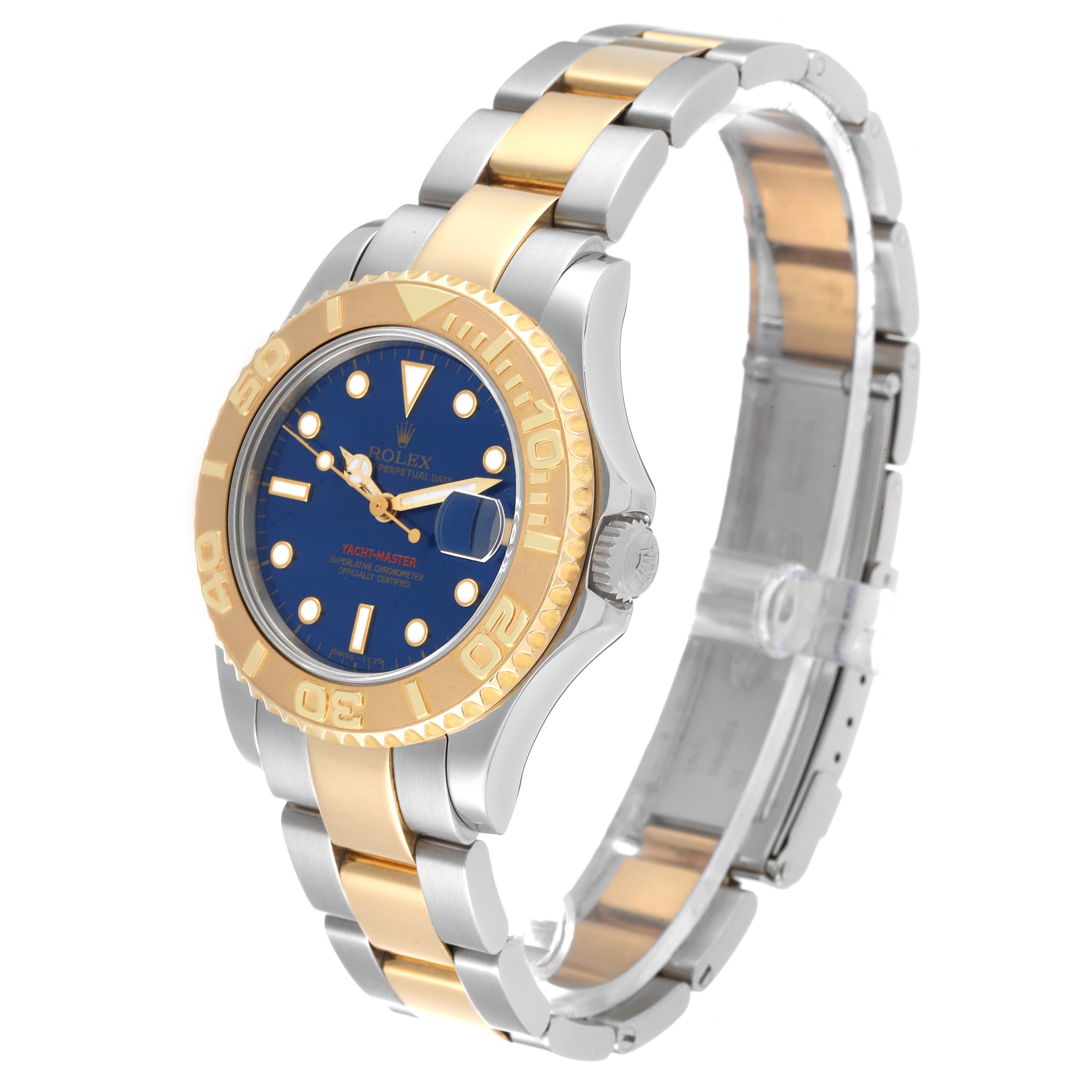 The image shows a Rolex Yacht-Master 68623 Men's Steel and Gold (two tone) Blue Dial 68623 Men's Steel and Gold (two tone) Blue Dial watch at a side angle, highlighting its blue dial, gold bezel, and two-tone bracelet.
