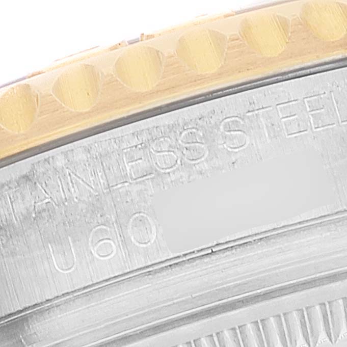 This close-up shows the bezel and engraved case side of a Rolex Yacht-Master 68623 Men's Steel and Gold (two tone) Blue Dial 68623 Men's Steel and Gold (two tone) Blue Dial watch.