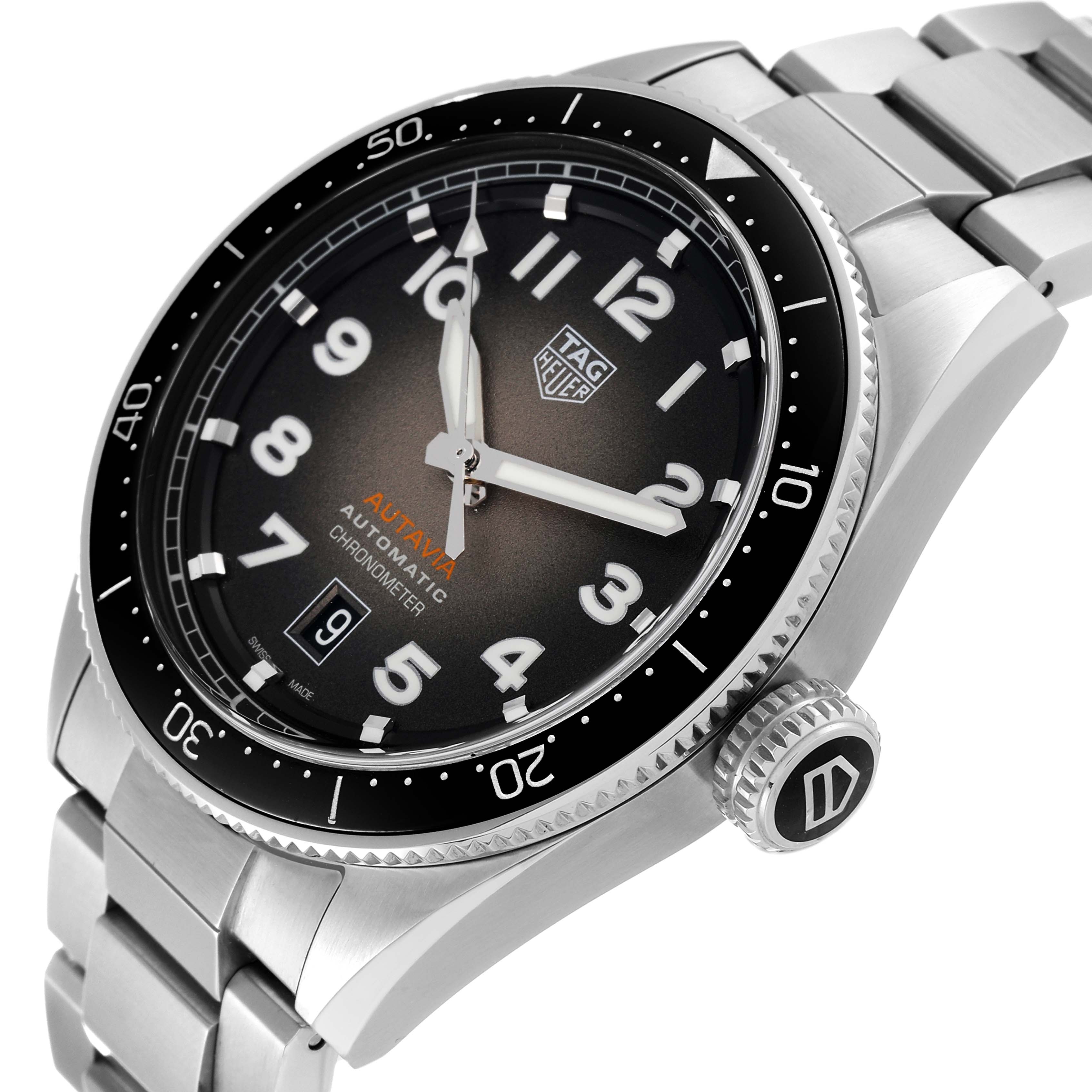 The image shows a Tag Heuer Autavia WBE5114.EB0173 Men's Stainless Steel Brown Dial WBE5114.EB0173 Men's Stainless Steel Brown Dial watch at a slight side angle, featuring its dial, bezel, crown, and stainless steel bracelet.
