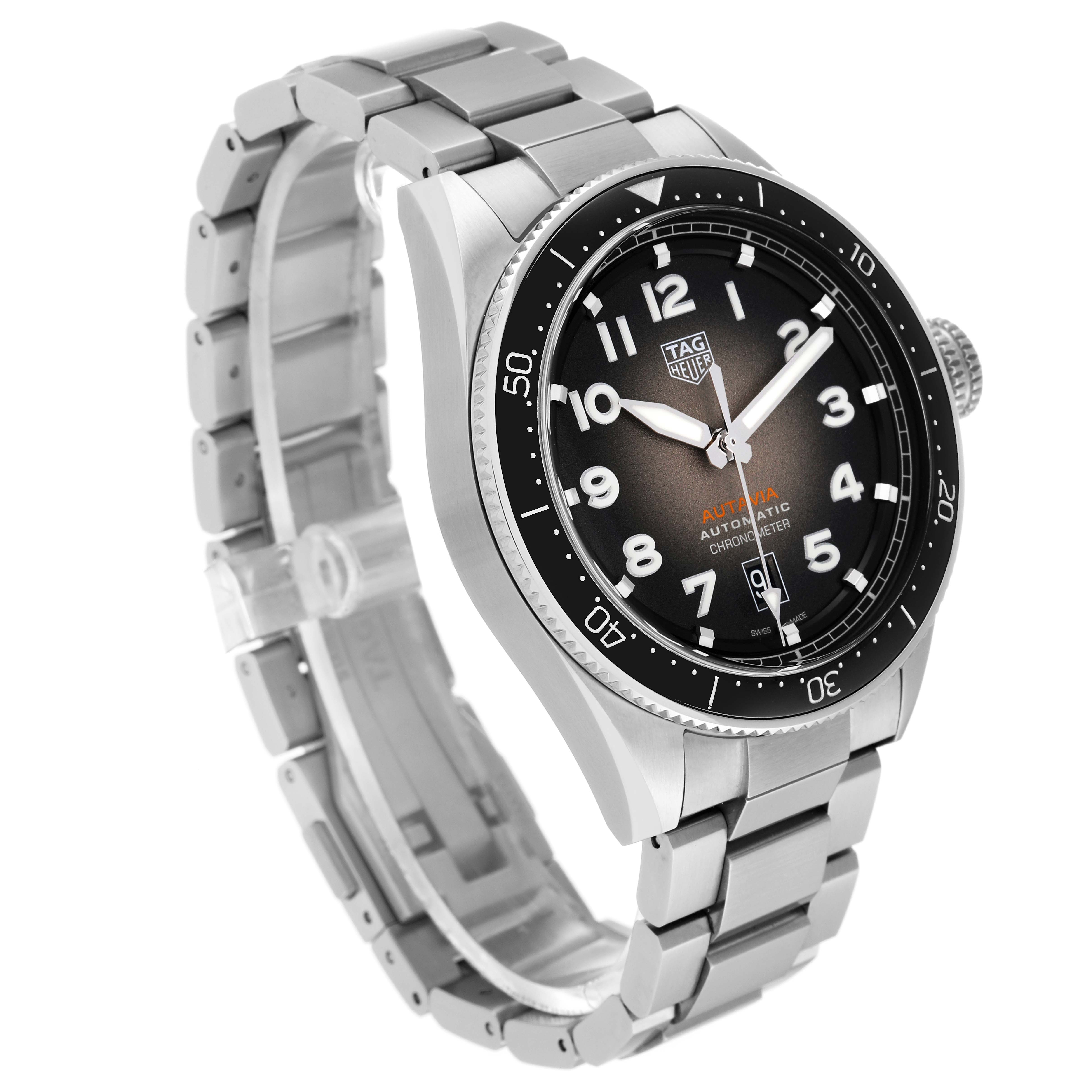 The image shows a side and angled view of the Tag Heuer Autavia WBE5114.EB0173 Men's Stainless Steel Brown Dial WBE5114.EB0173 Men's Stainless Steel Brown Dial model watch, highlighting its stainless steel bracelet and black dial.