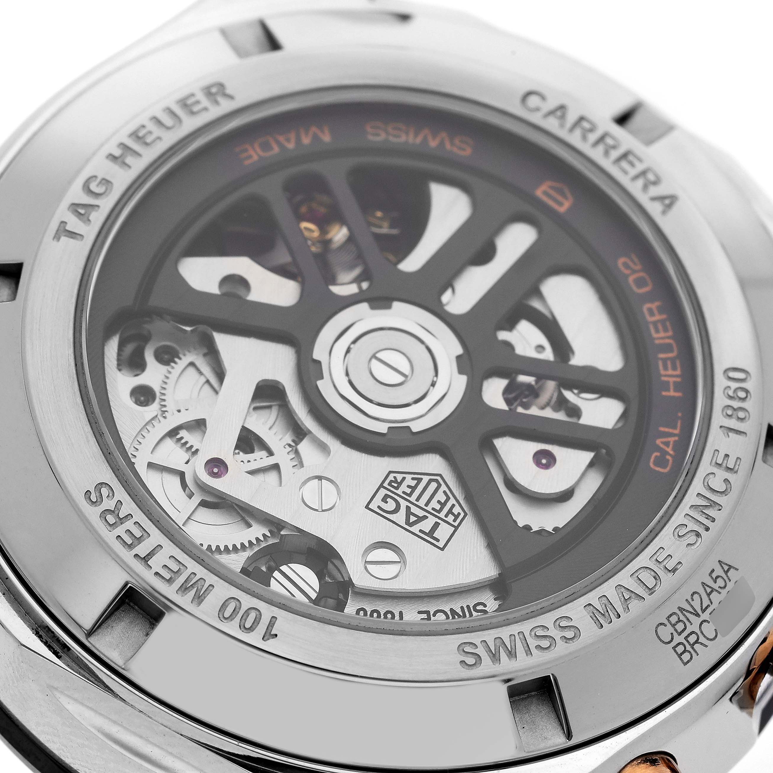 The image shows the back view of the Tag Heuer Carrera CBN2A5A.FC6481 Men's Steel and Gold (two tone) Black Dial CBN2A5A.FC6481 Men's Steel and Gold (two tone) Black Dial watch, highlighting its intricate movement and mechanical parts.