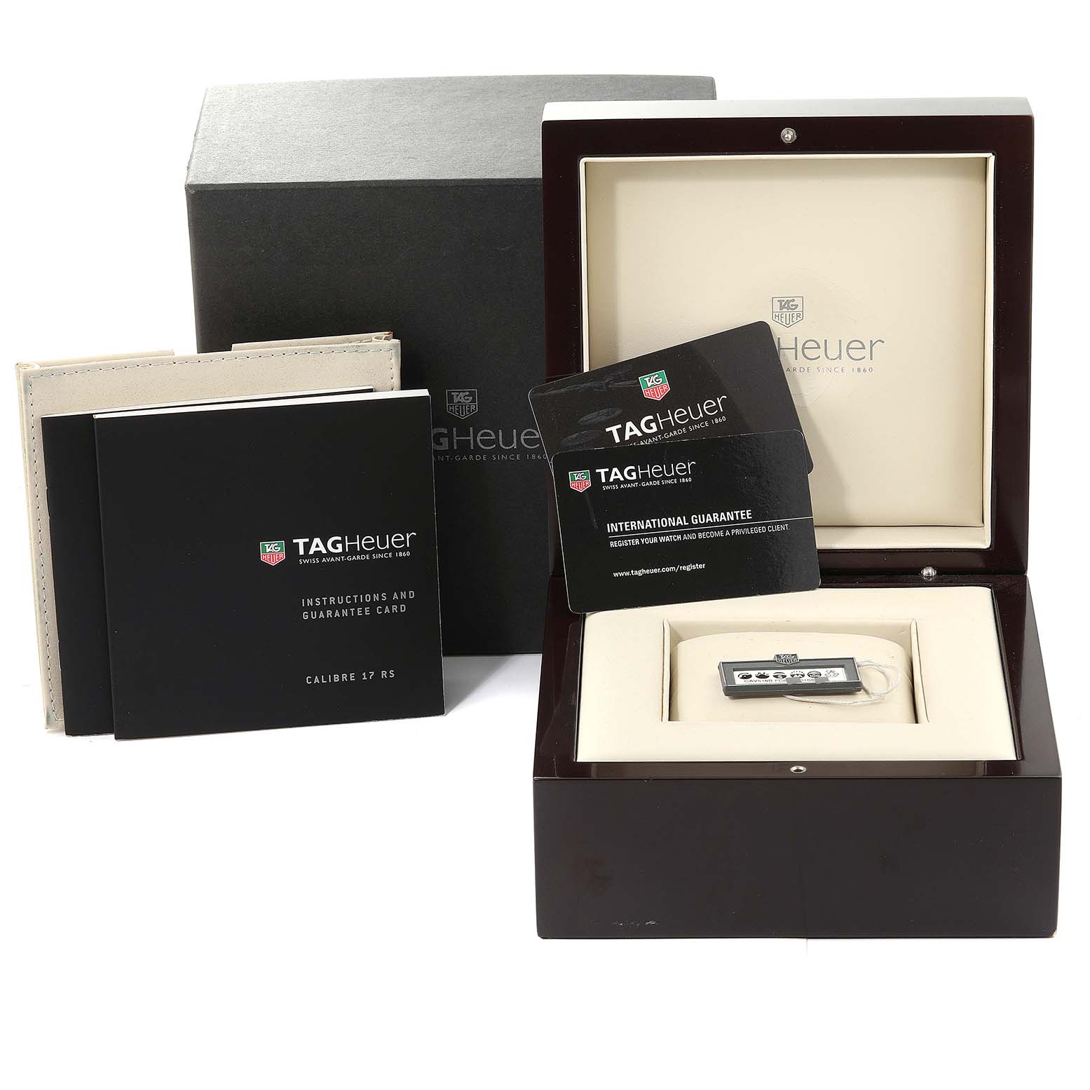 The image shows a Tag Heuer Carrera CAV518B.FT6016 Men's Titanium Black Dial CAV518B.FT6016 Men's Titanium Black Dial watch with its packaging, including a box, manuals, and warranty cards.